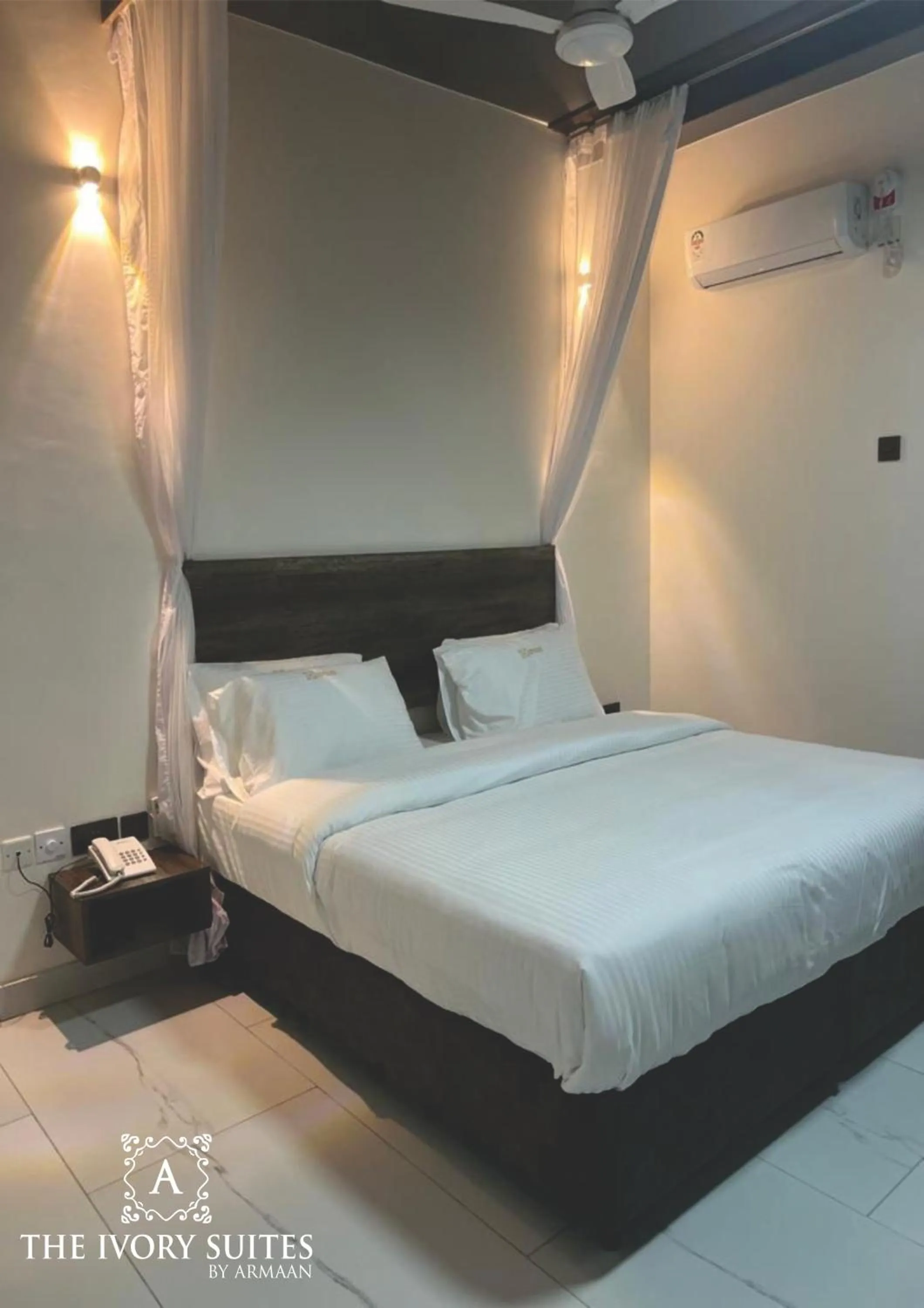 Bed in The Ivory Suites