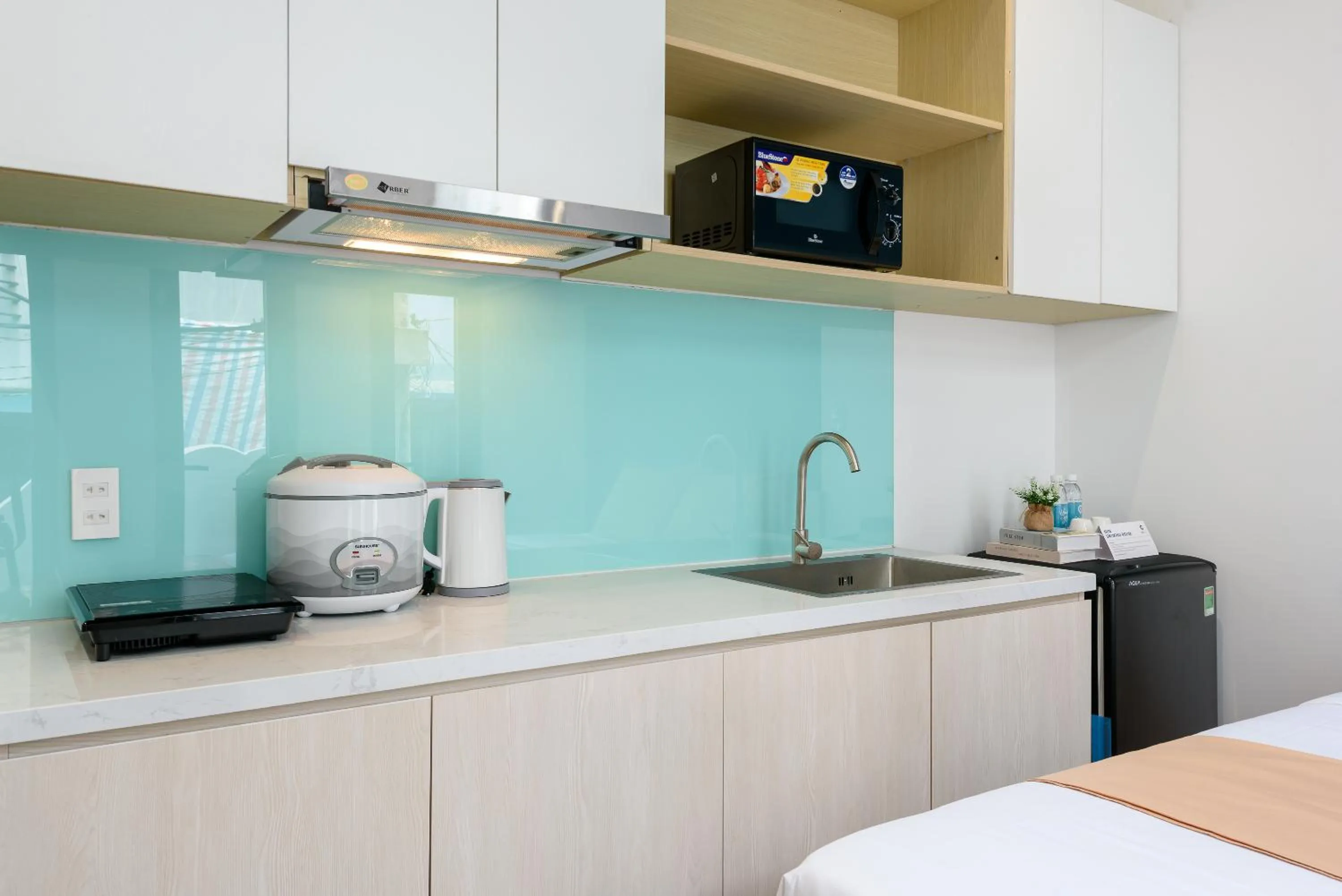 Kitchen or kitchenette in Cozrum Homes - June Corner