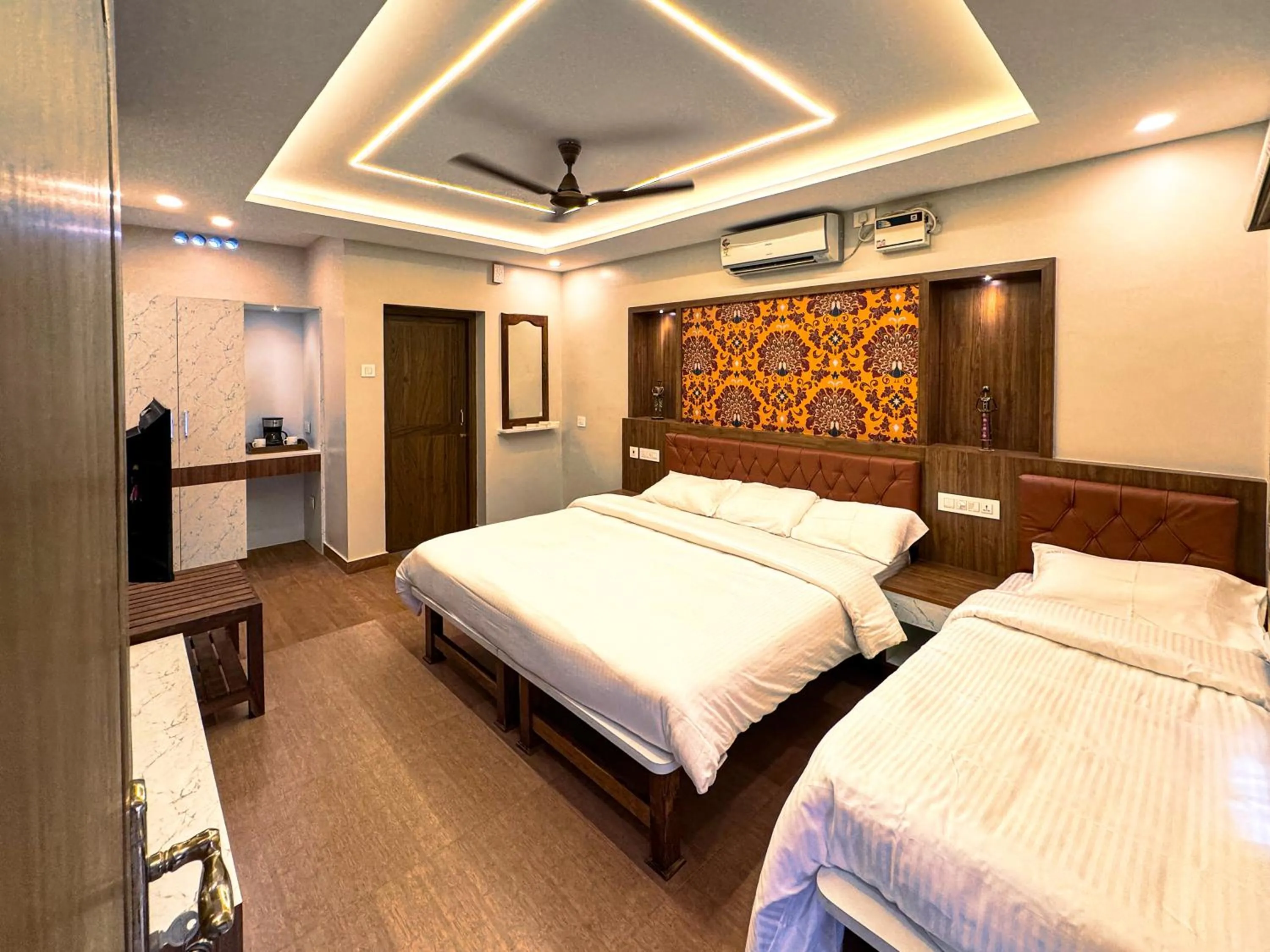 Bed in Srishty Garden Resorts