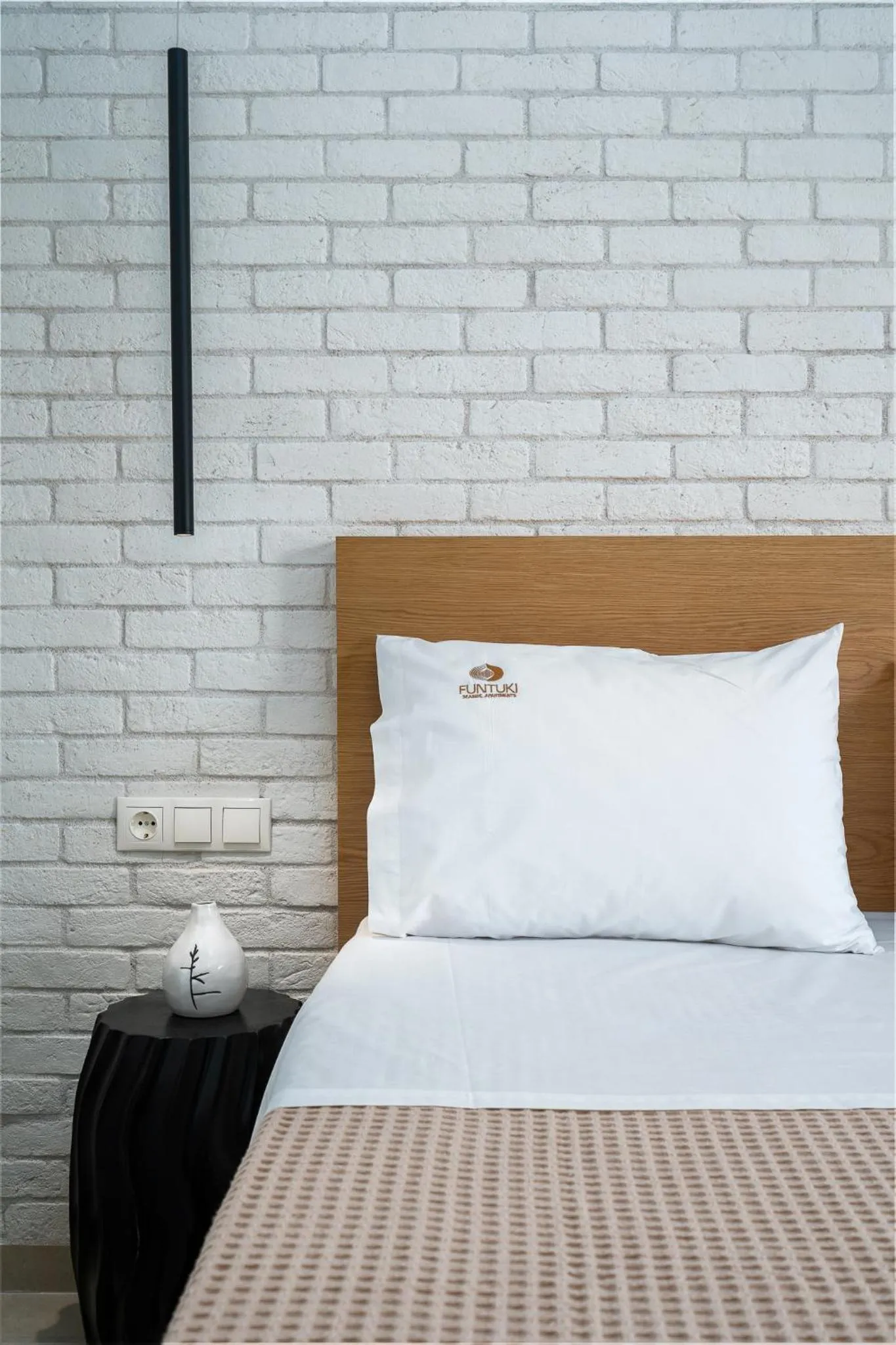 Bed in Funtuki Seaside Apartments