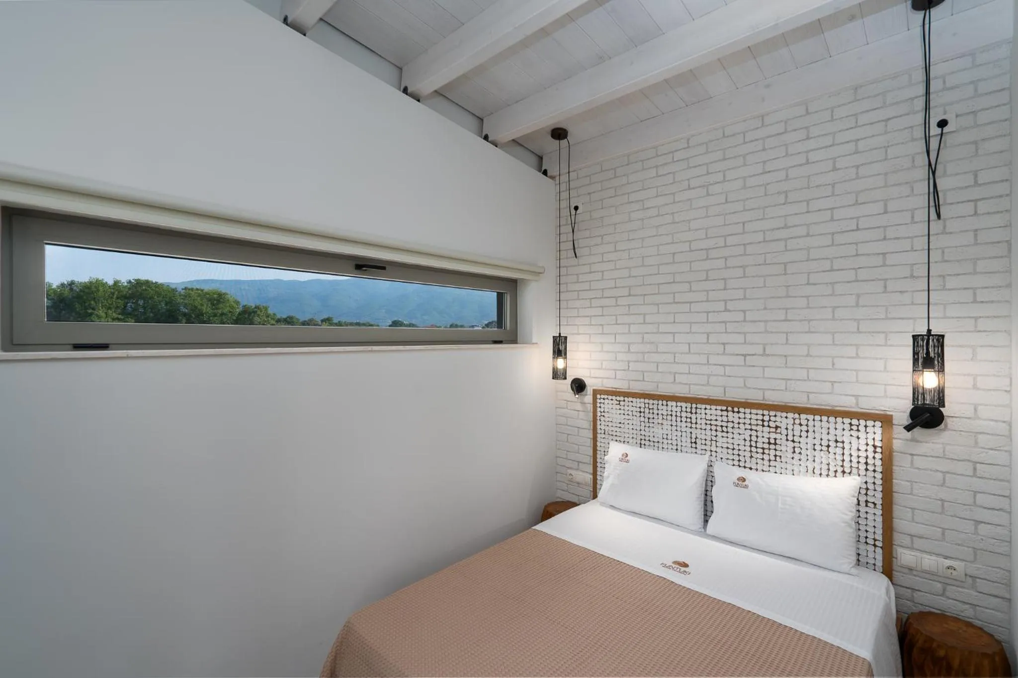 Bed in Funtuki Seaside Apartments