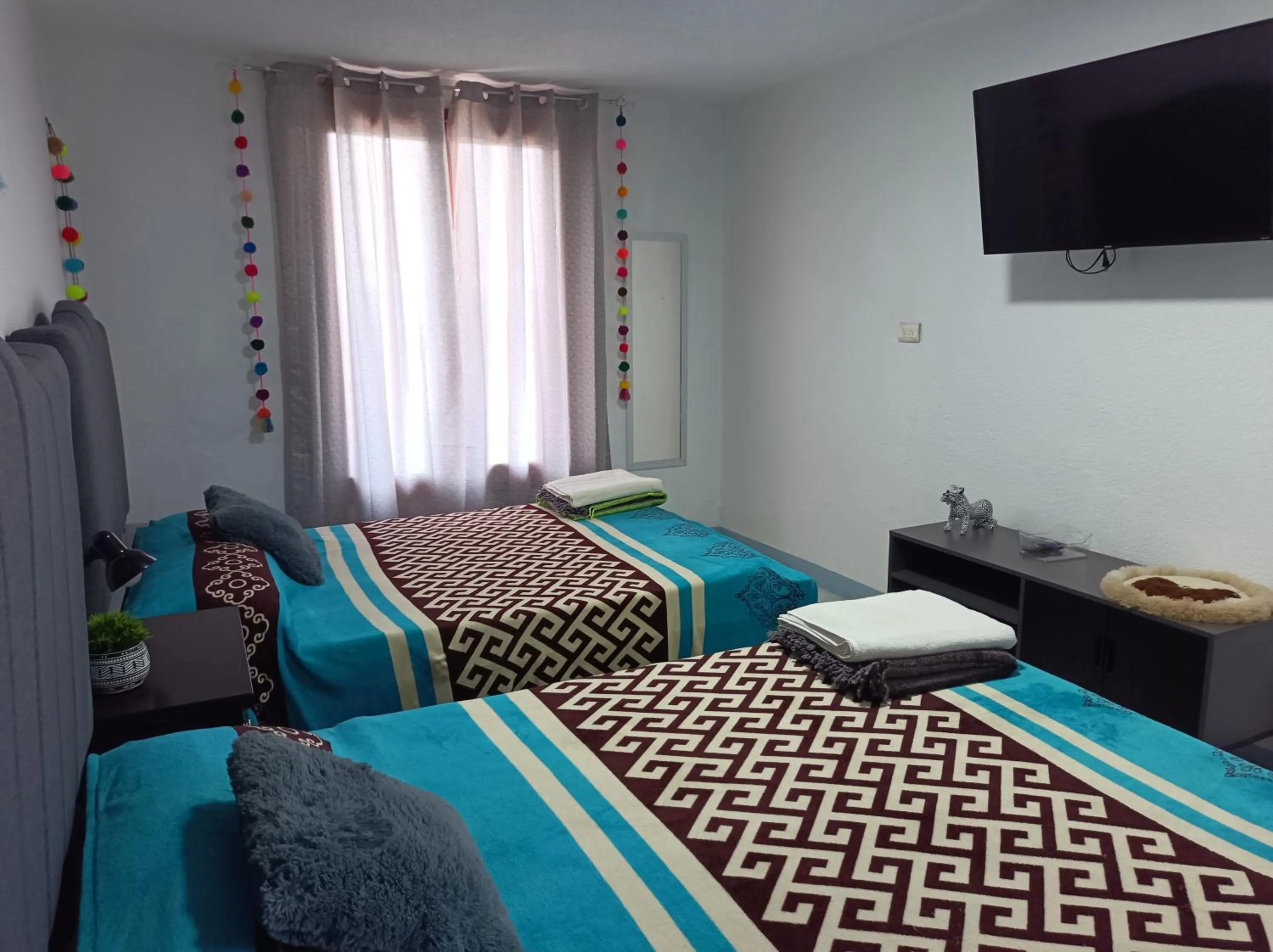 Communal lounge/ TV room, Bed in Calkiní Cabañas San Cristóbal de Las Casas