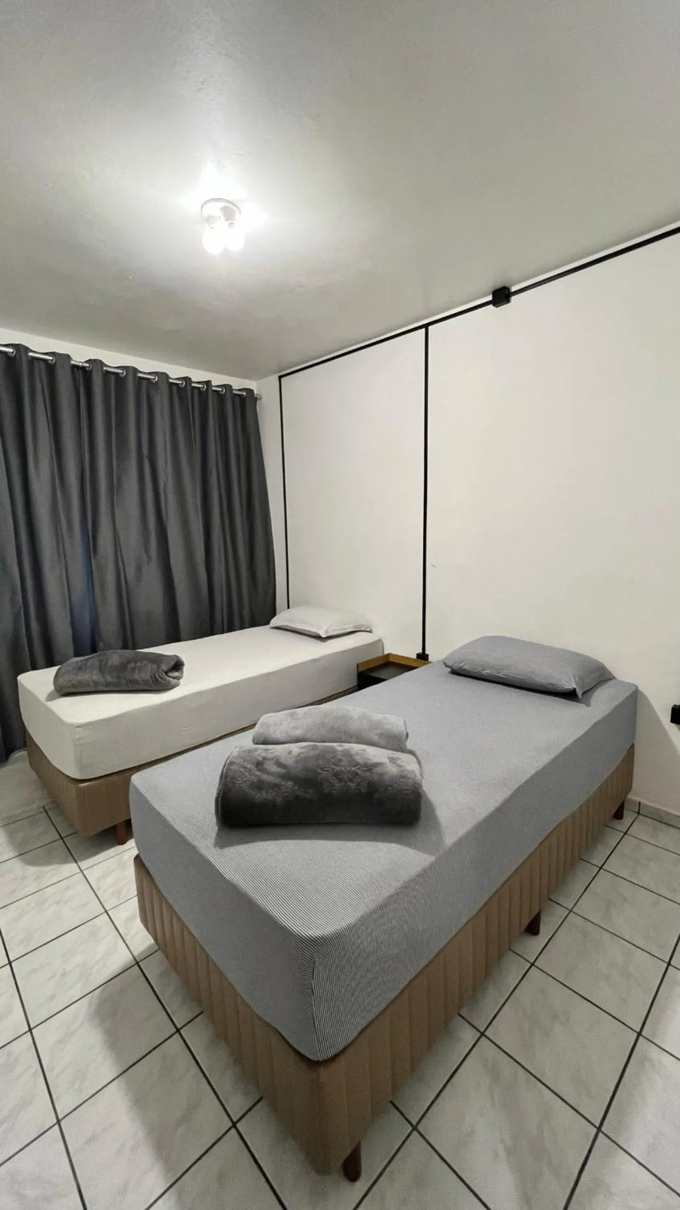 Bed in Pousada Central Jaraguá