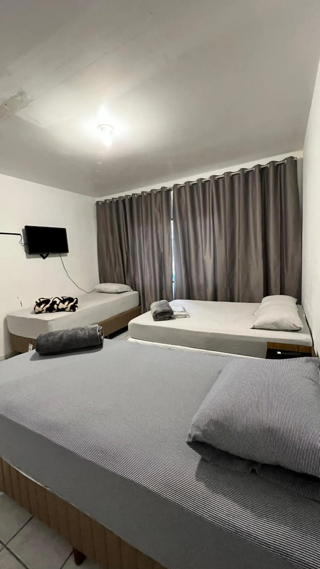 Bed in Pousada Central Jaraguá