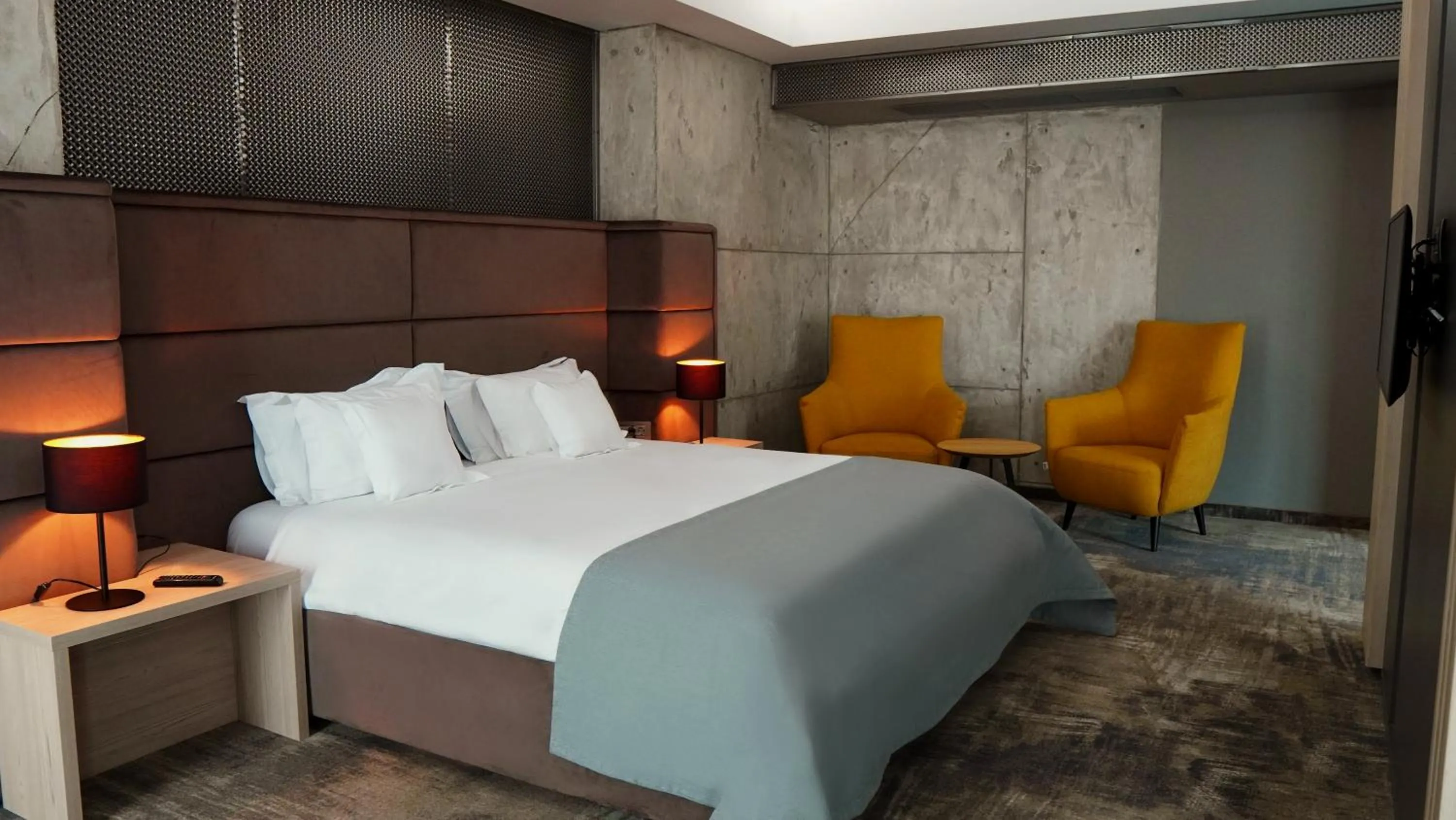 Seating area, Bed in Aniroc Signature Hotel