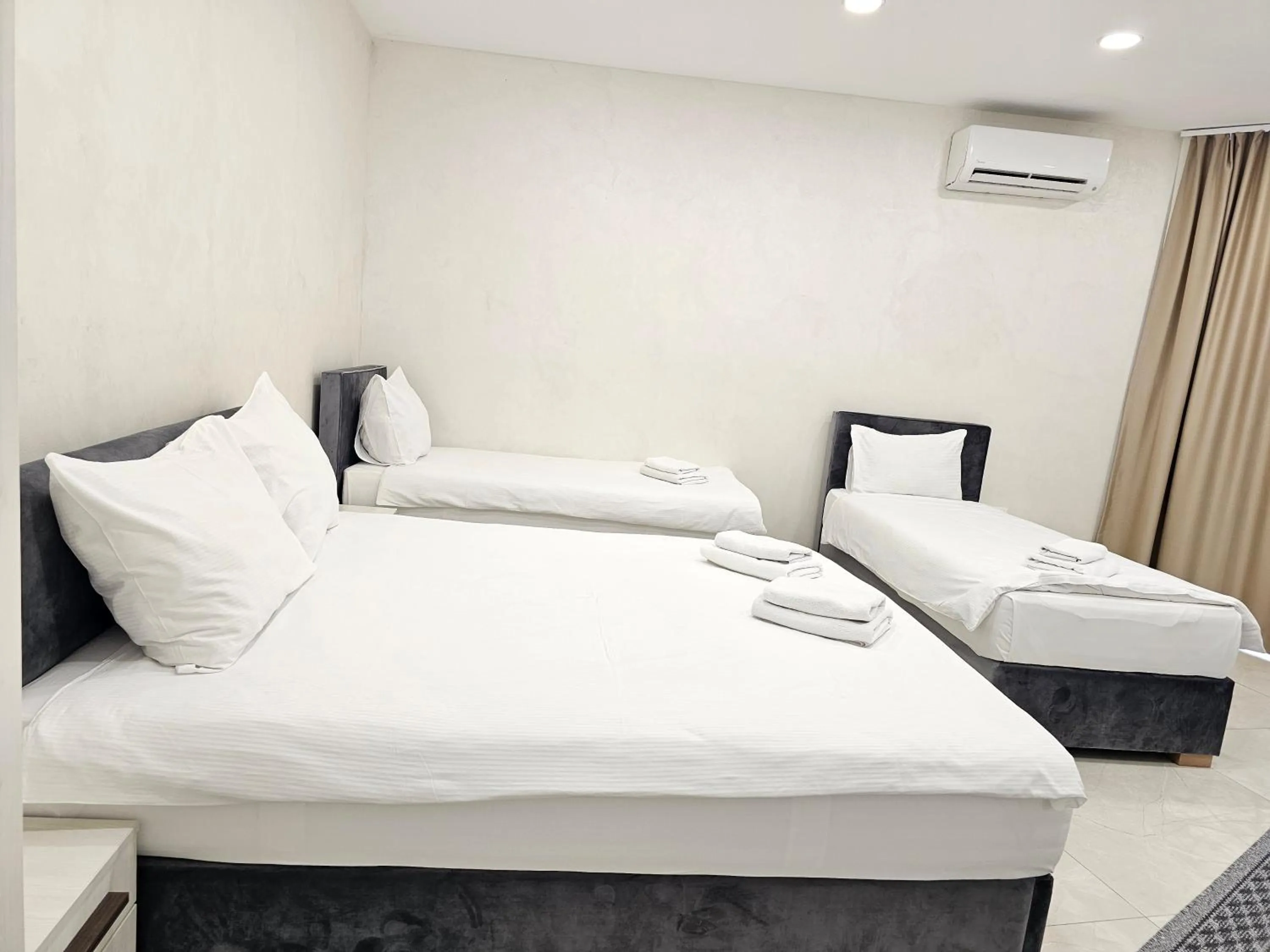 Bed in Ornament Hotel and Apartments