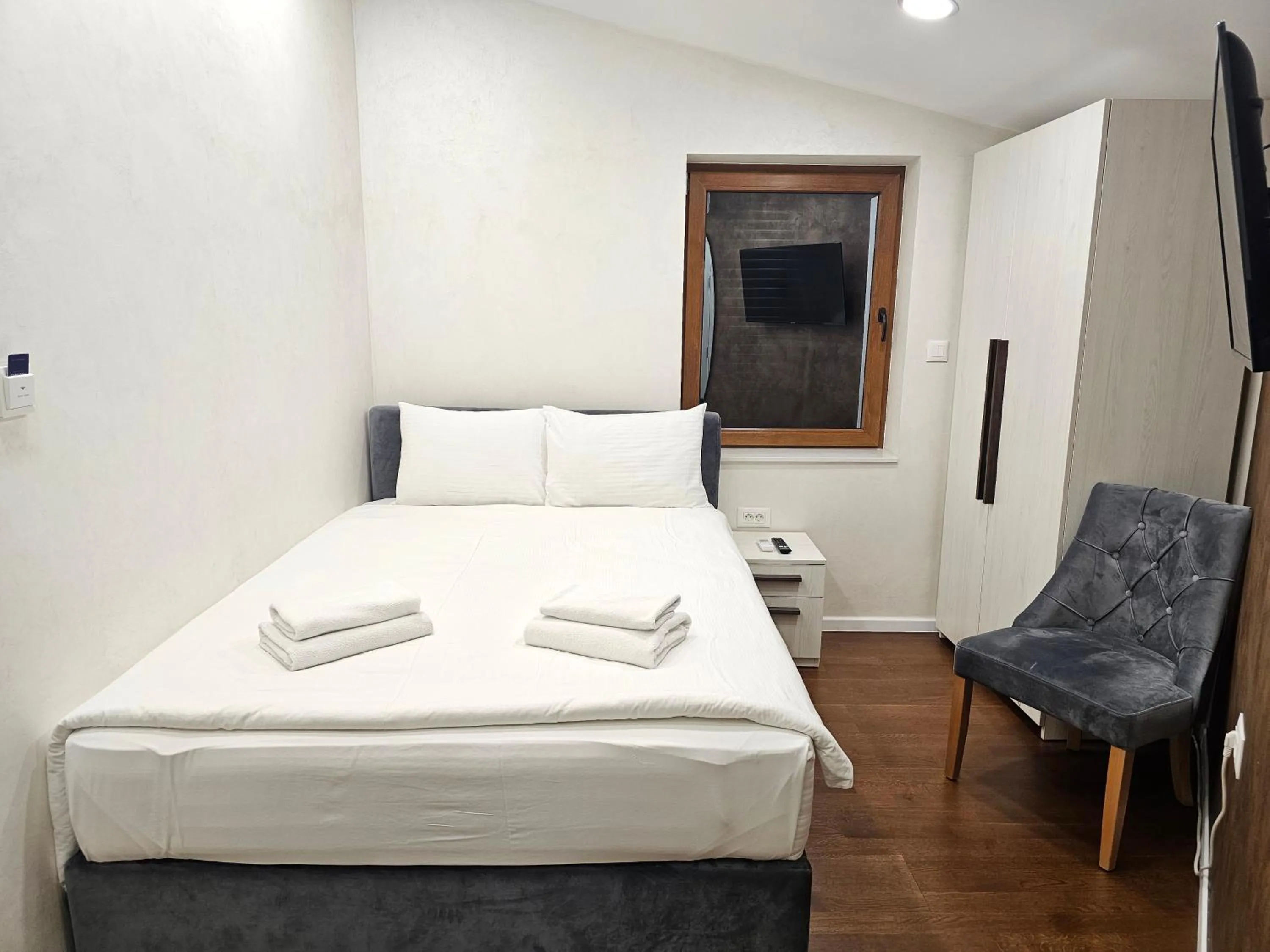 Bed in Ornament Hotel and Apartments