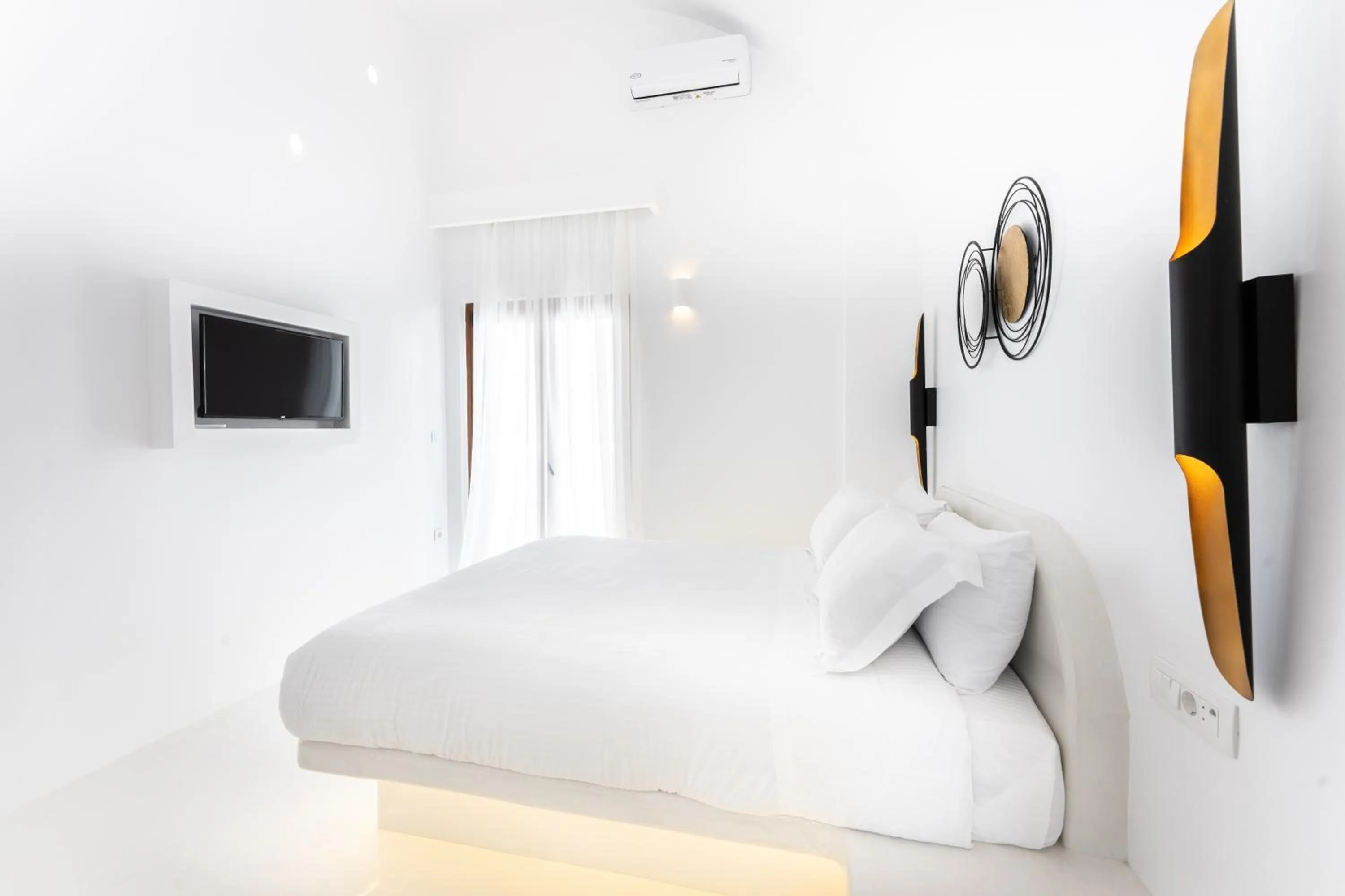 Bed in Leon Luxury Suites