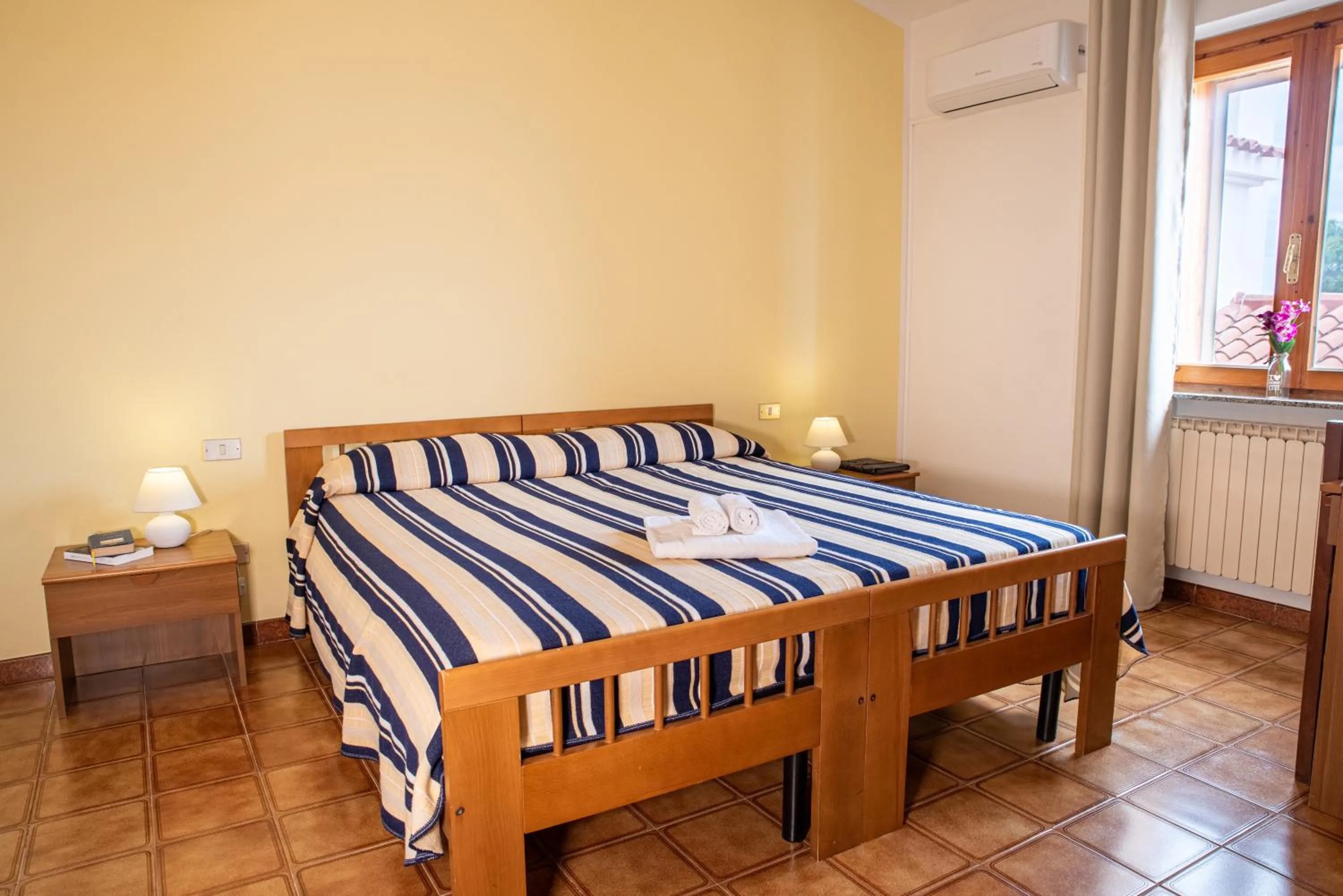 Bed in Hotel L'Aragosta