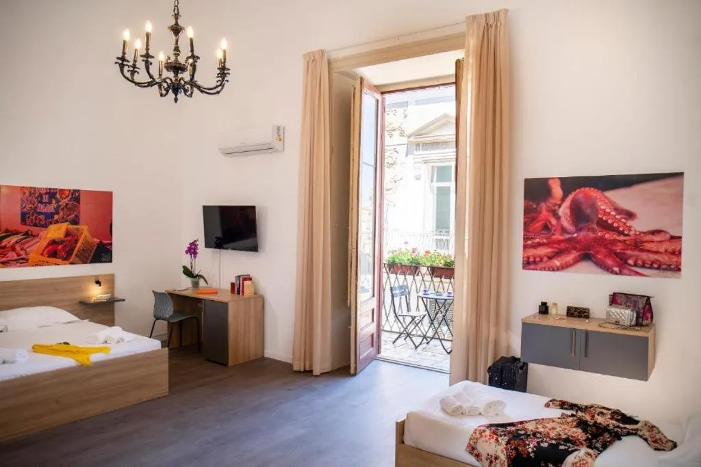 Bed in Ballaro' Hotel - Budget Room