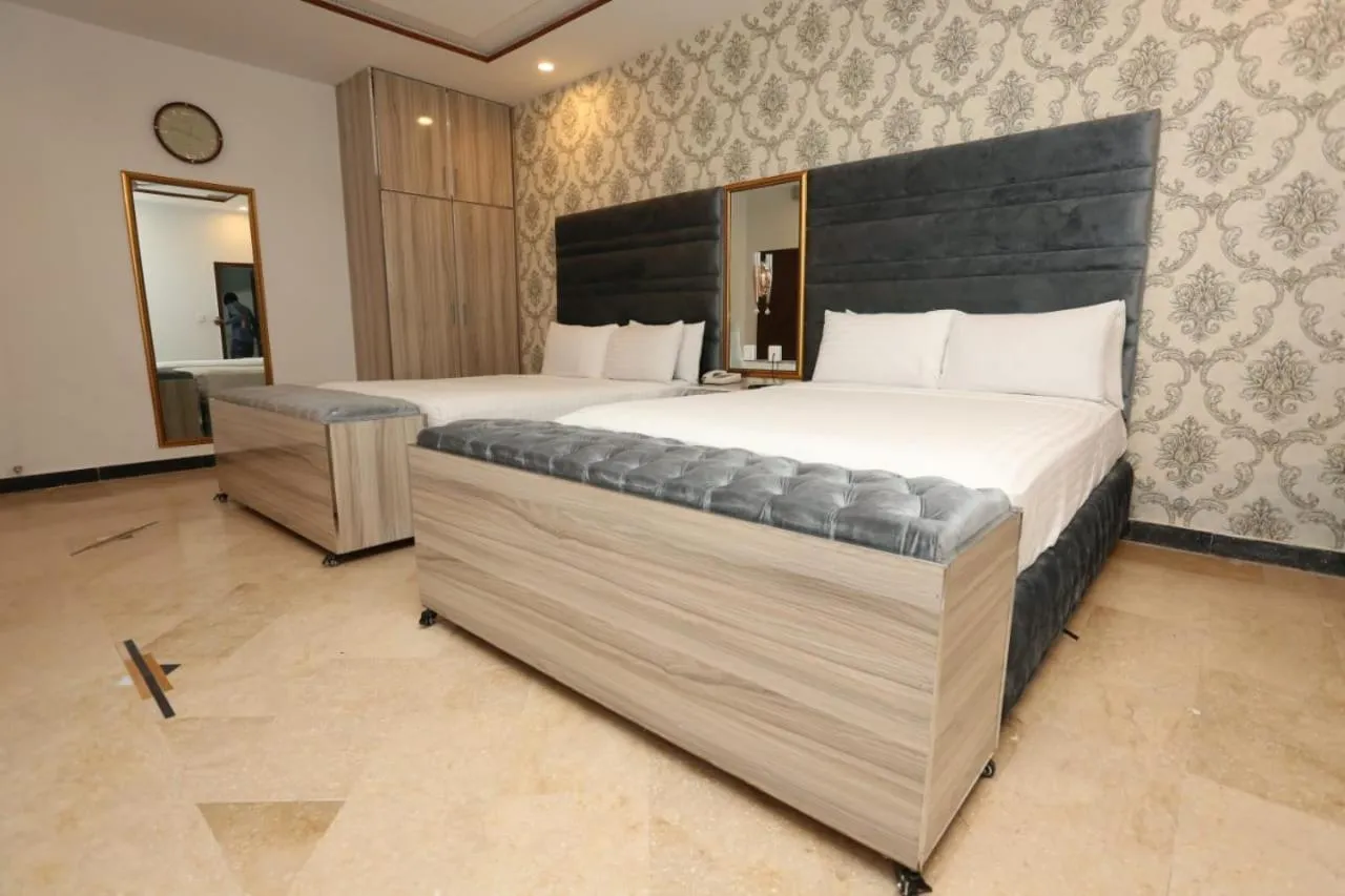 Bed in Grand Swiss Hotel&Apartment Lahore