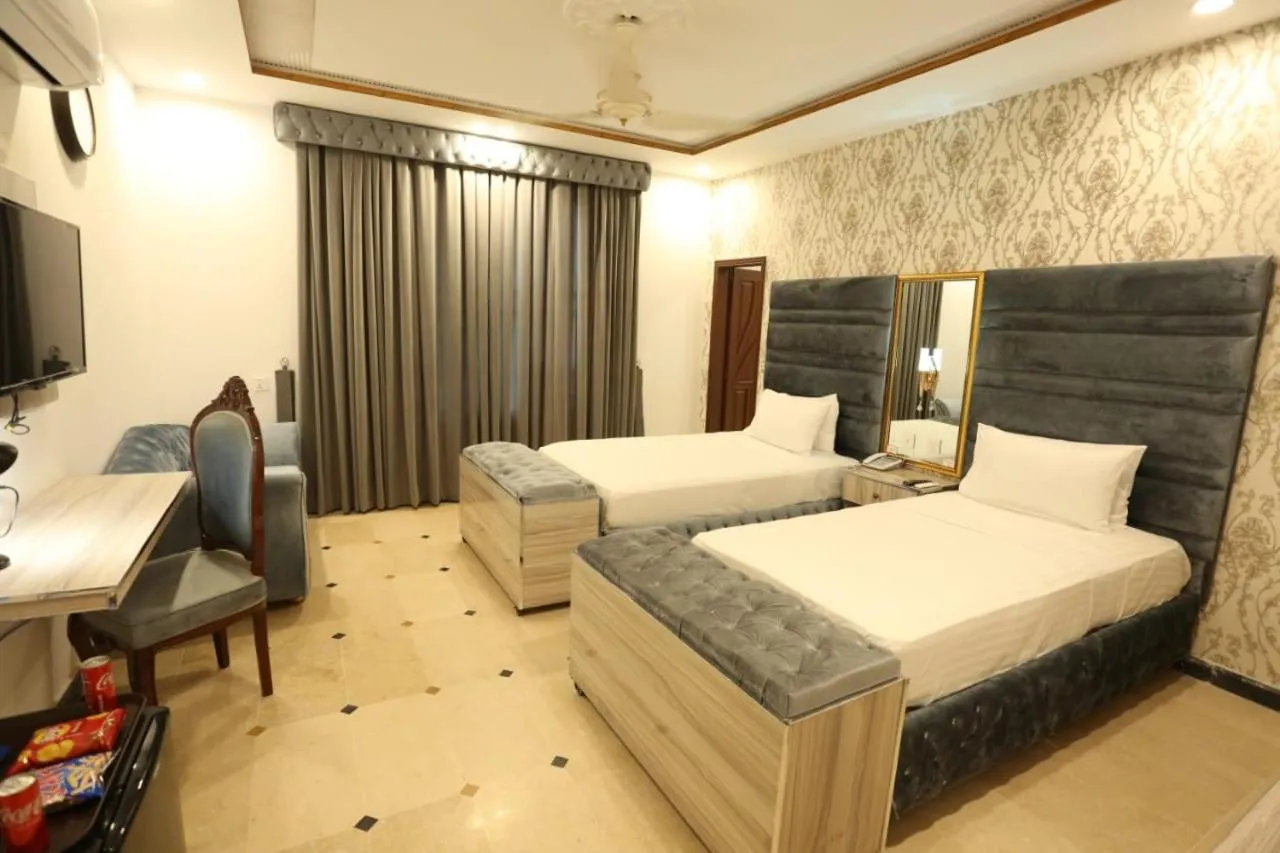 Bed in Grand Swiss Hotel&Apartment Lahore