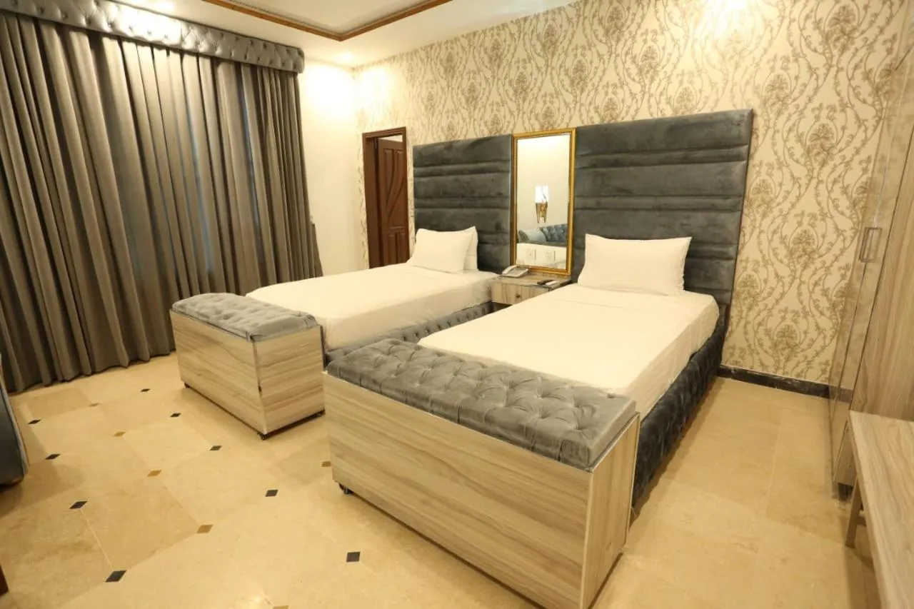 Photo of the whole room, Bed in Grand Swiss Hotel&Apartment Lahore