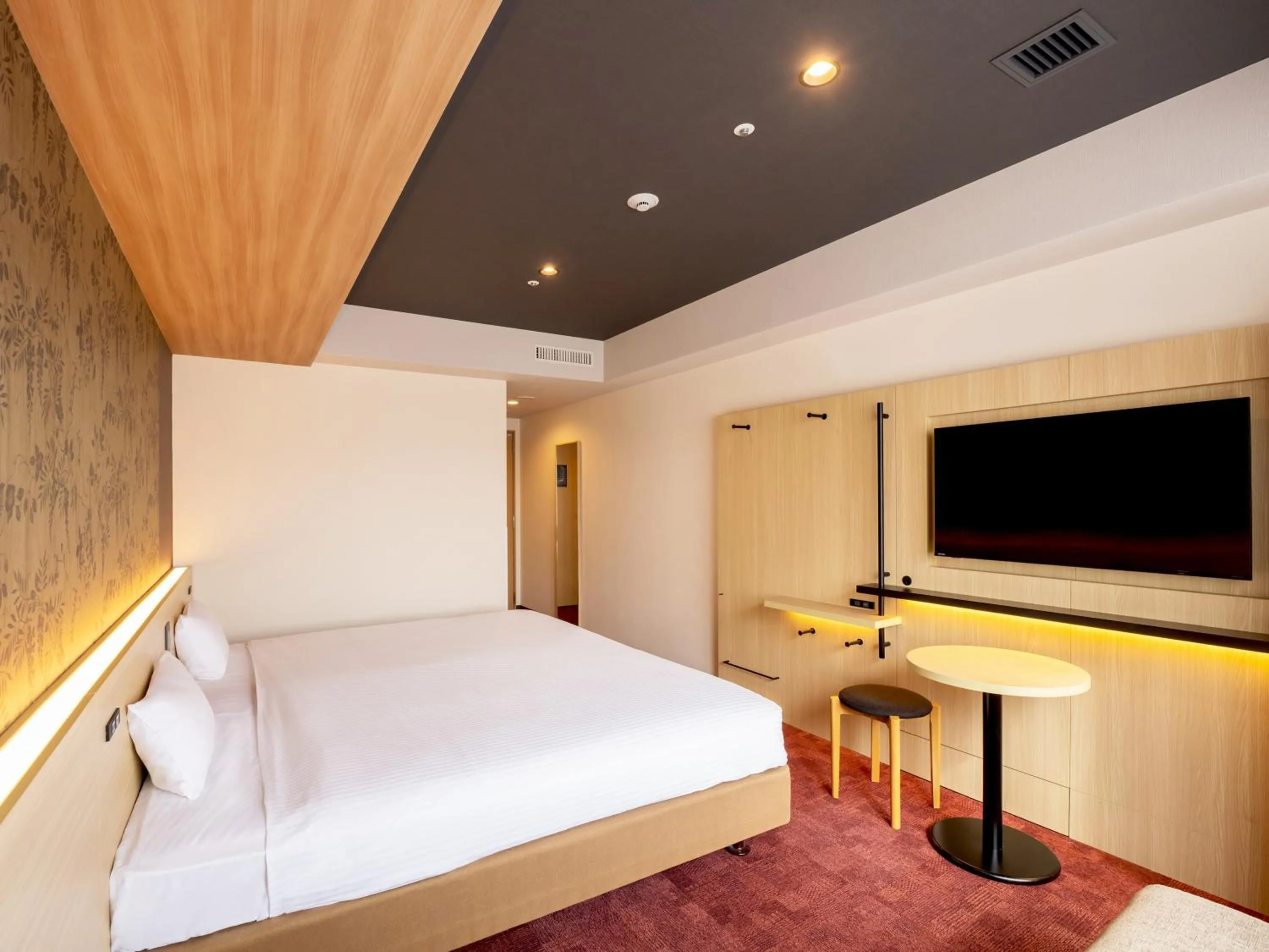 Bed in CHISUN PREMIUM Kyoto Kujo