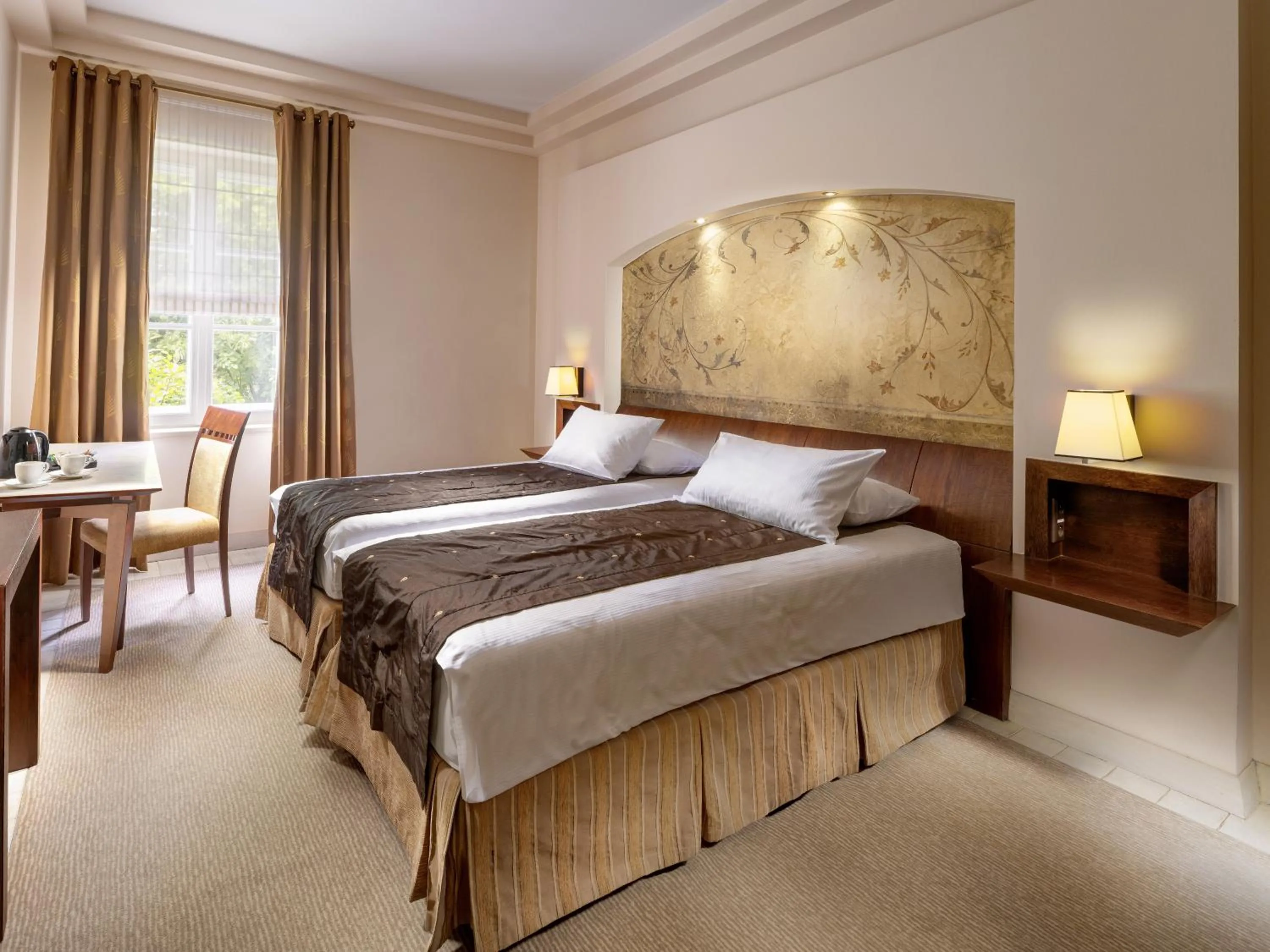 Bed in Mamaison Le Regina Boutique Hotel