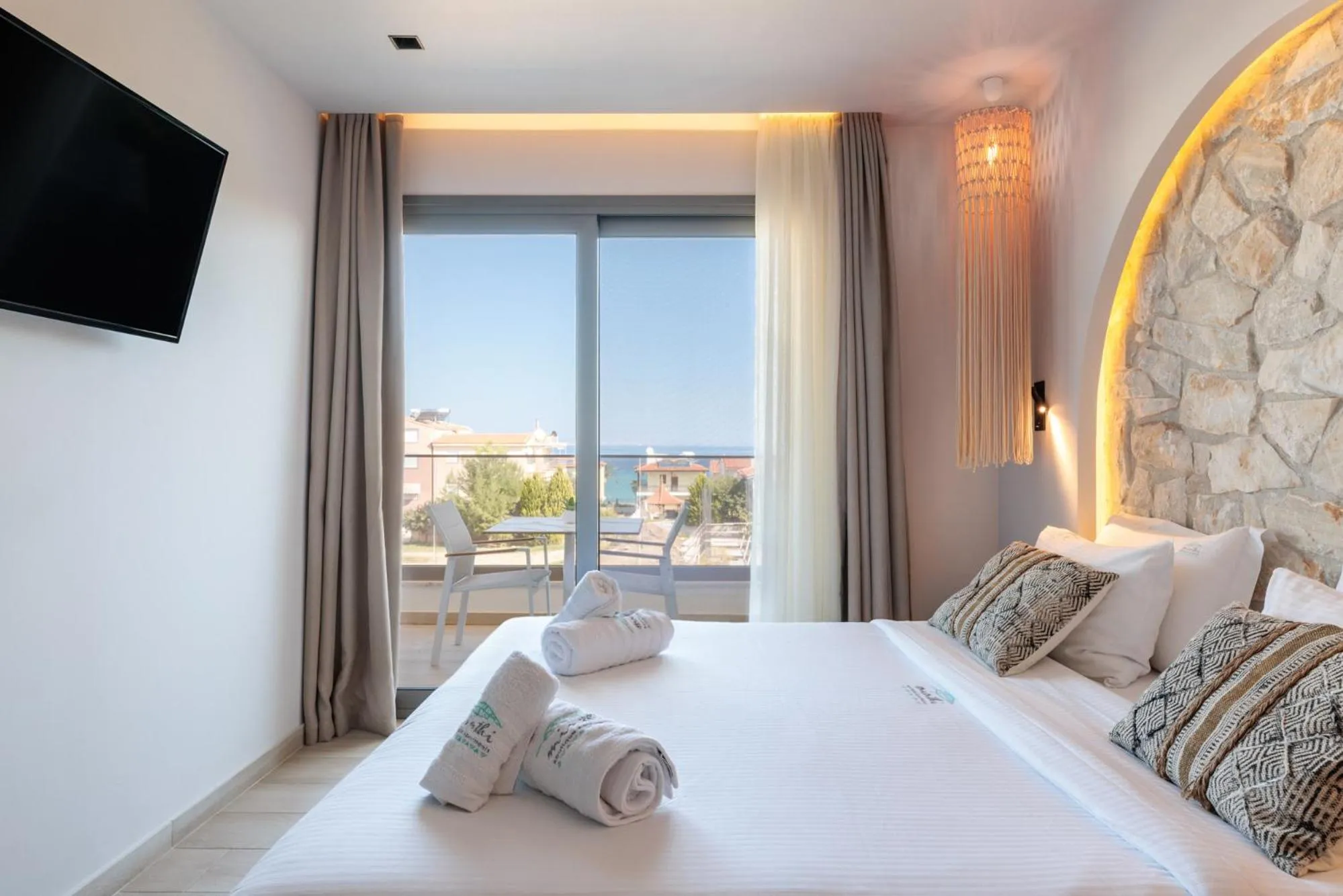 Bed in Amalthia Luxury Suites