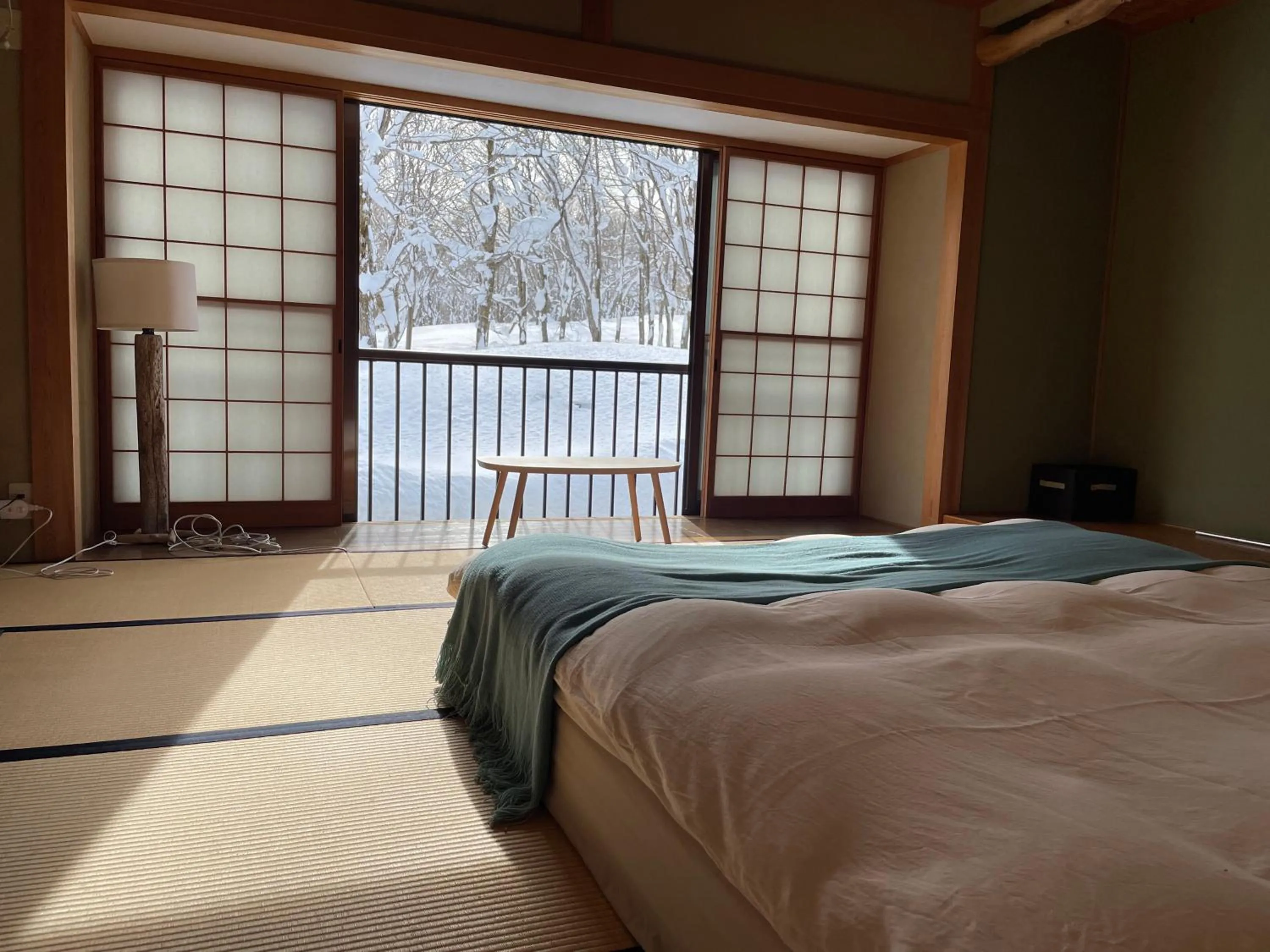 Bed in Myoko Woodland Lodge