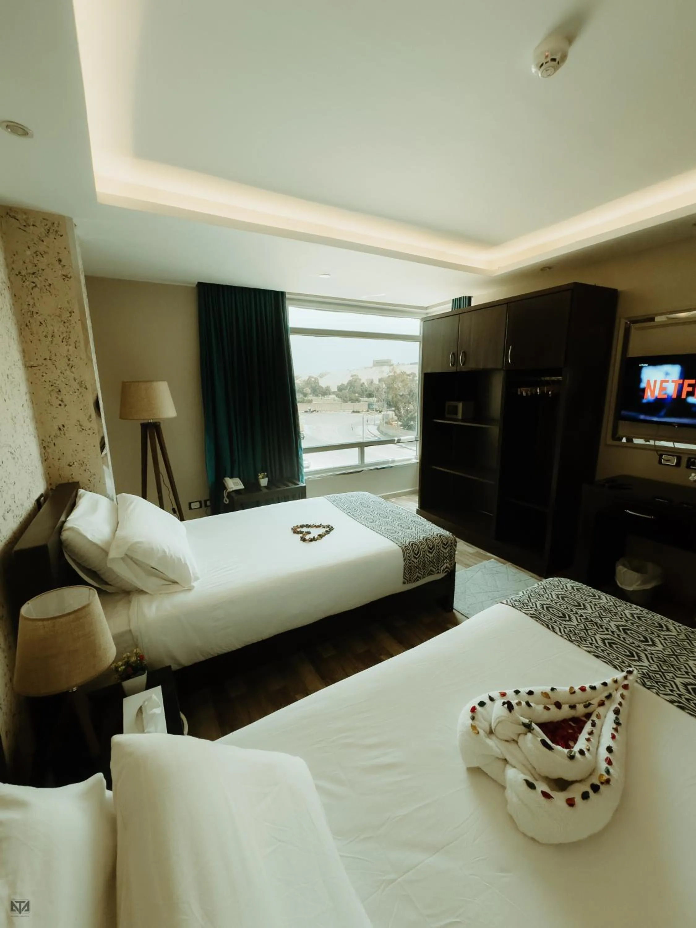 Bed in Turquoise Pyramids & Grand Egyptian museum view Hotel