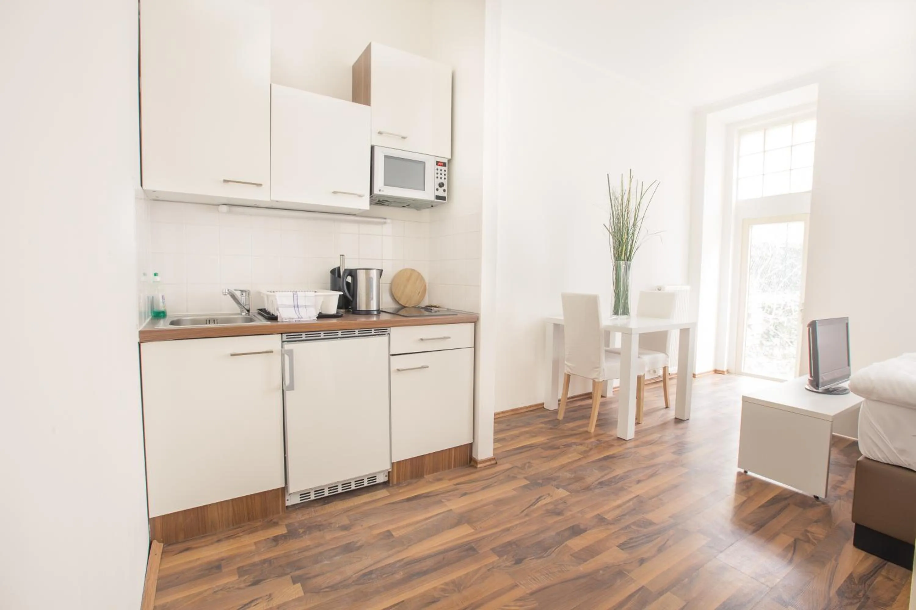 Kitchen or kitchenette in Grand Central Station Apartments I contactless check-in