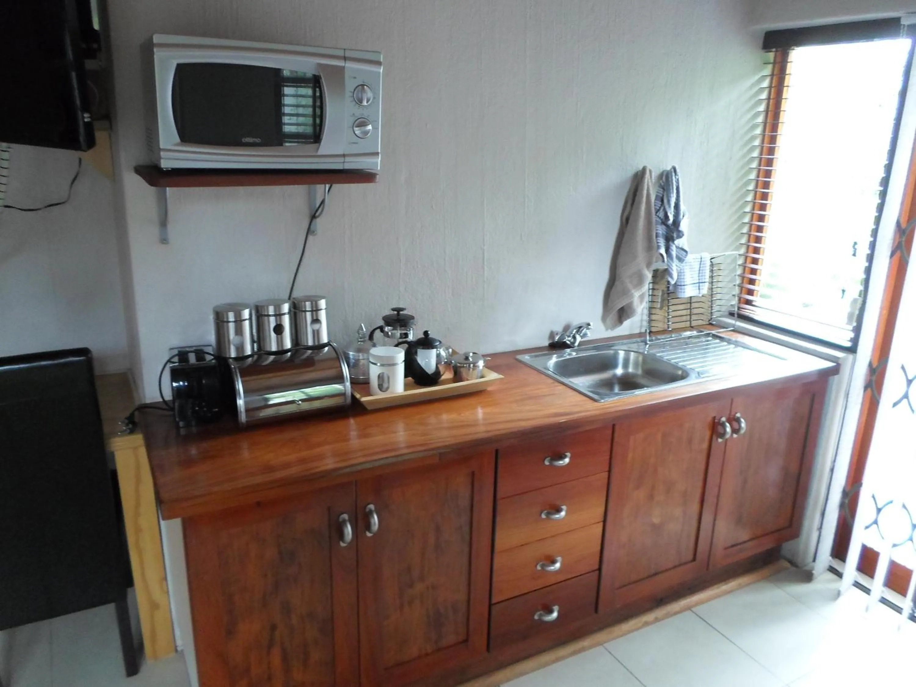 Kitchen or kitchenette in Waterkloof Apartments