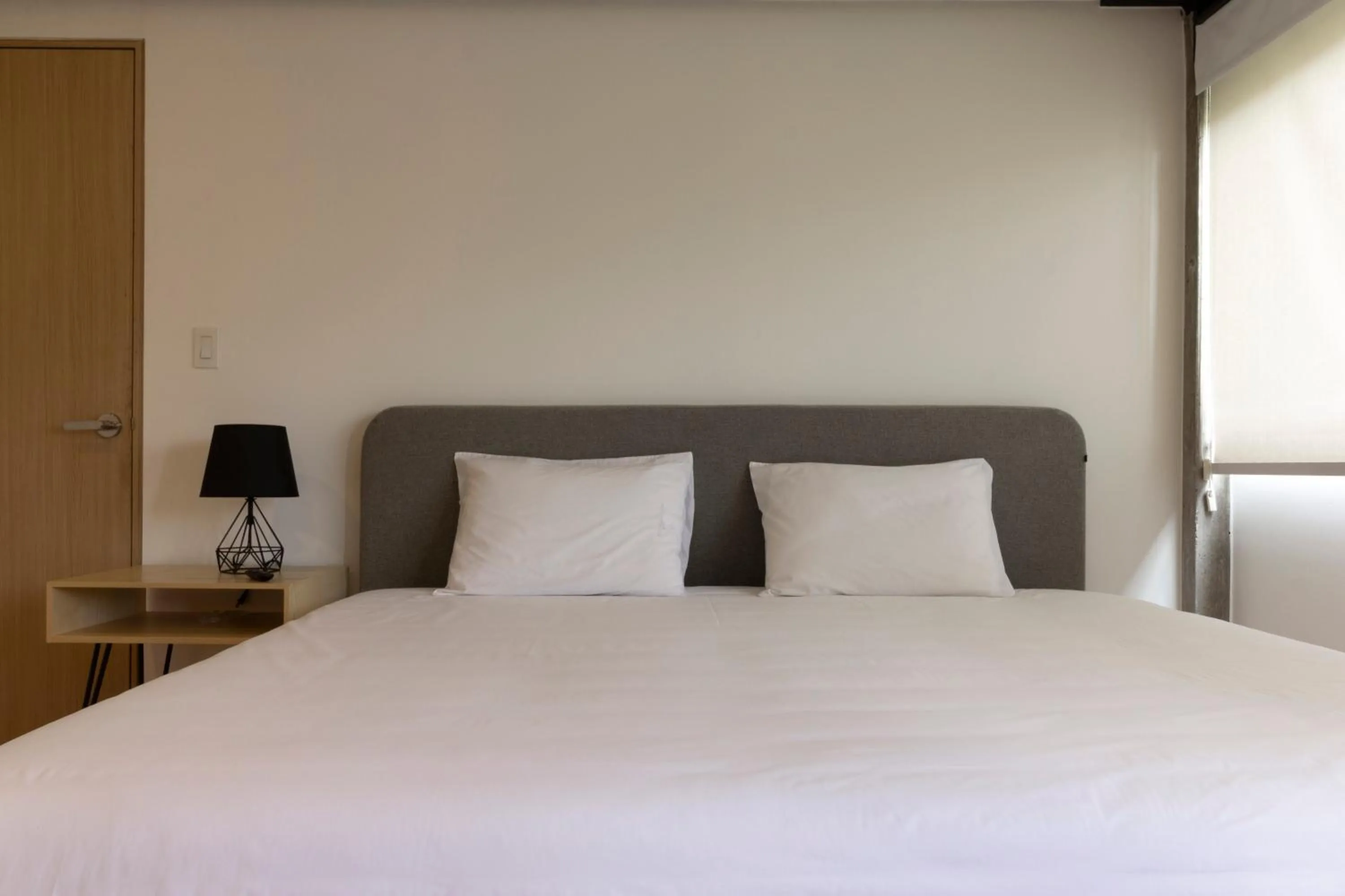 Bed in El Doce by HomiRent