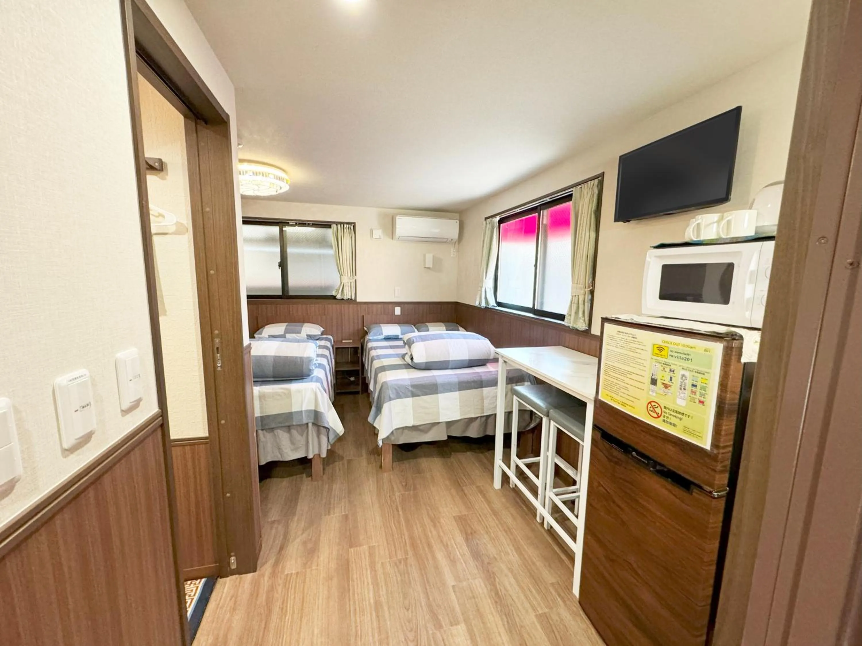 Bed in SHINJUKU WARM VILLA I