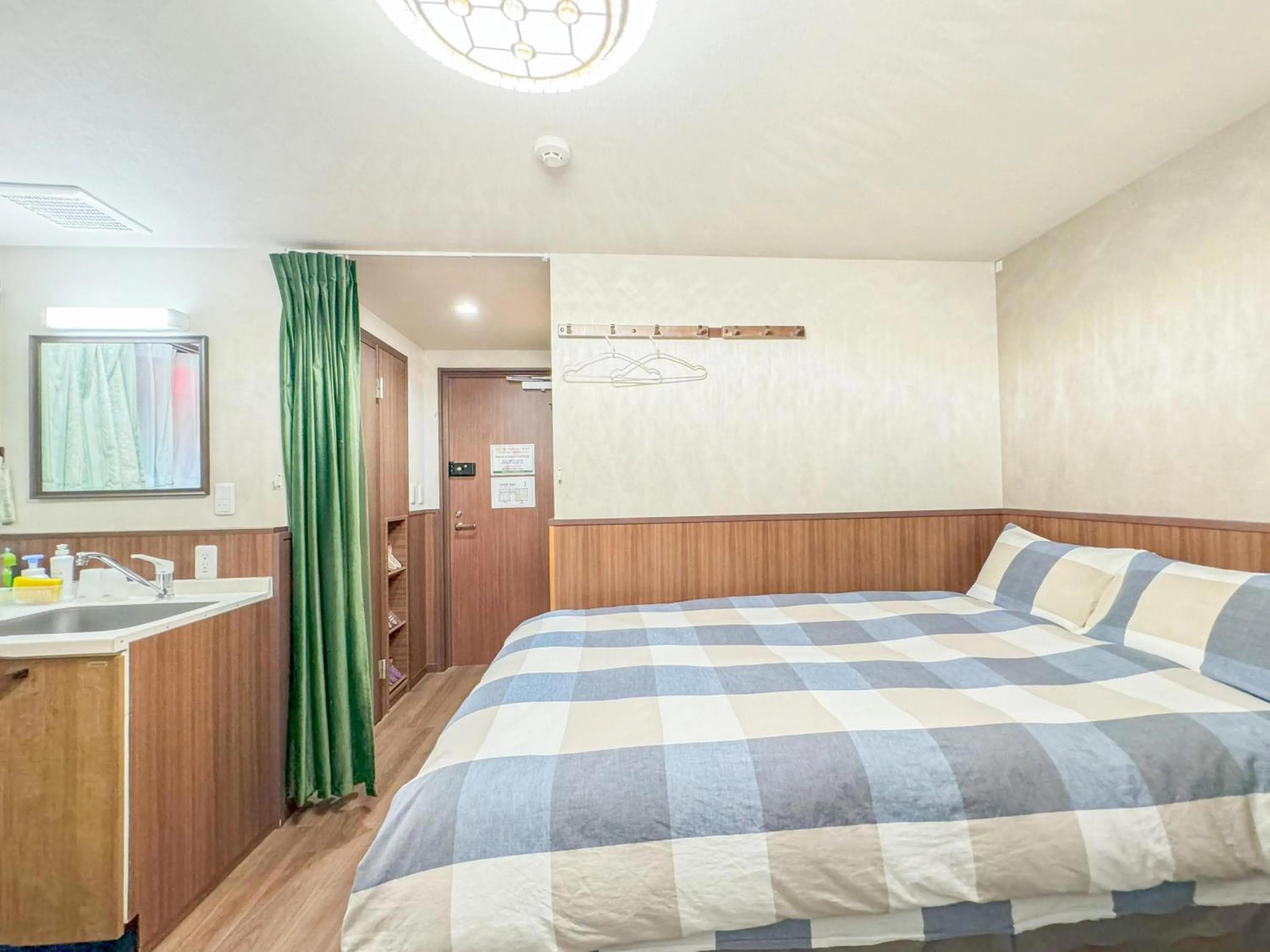 Bed in SHINJUKU WARM VILLA I