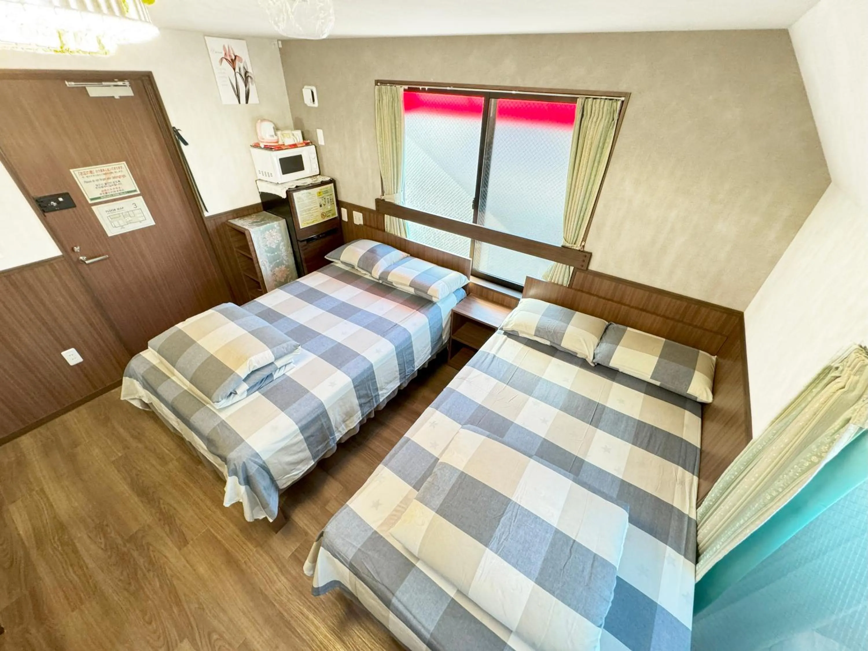 Bed in SHINJUKU WARM VILLA I