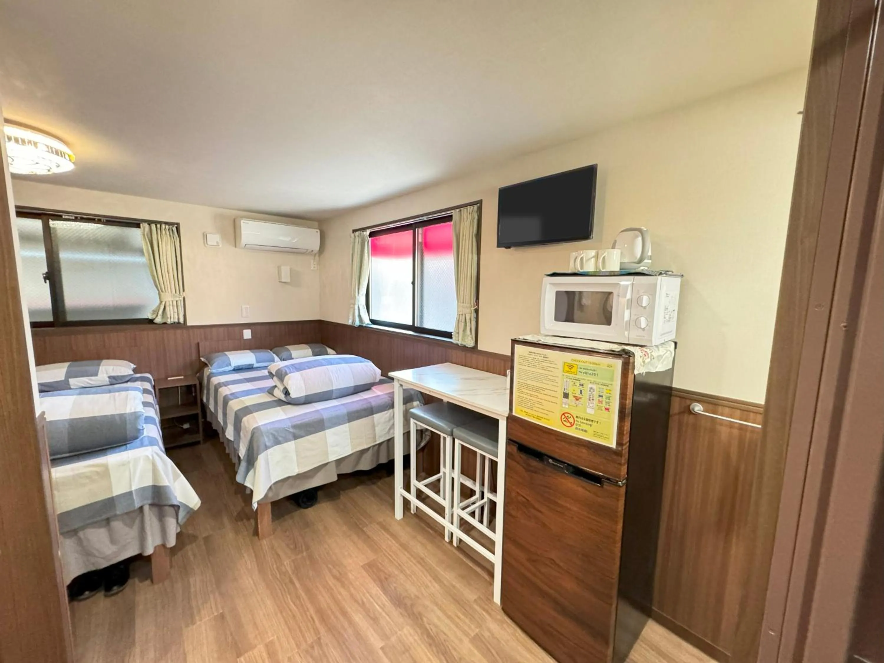 Bed in SHINJUKU WARM VILLA I