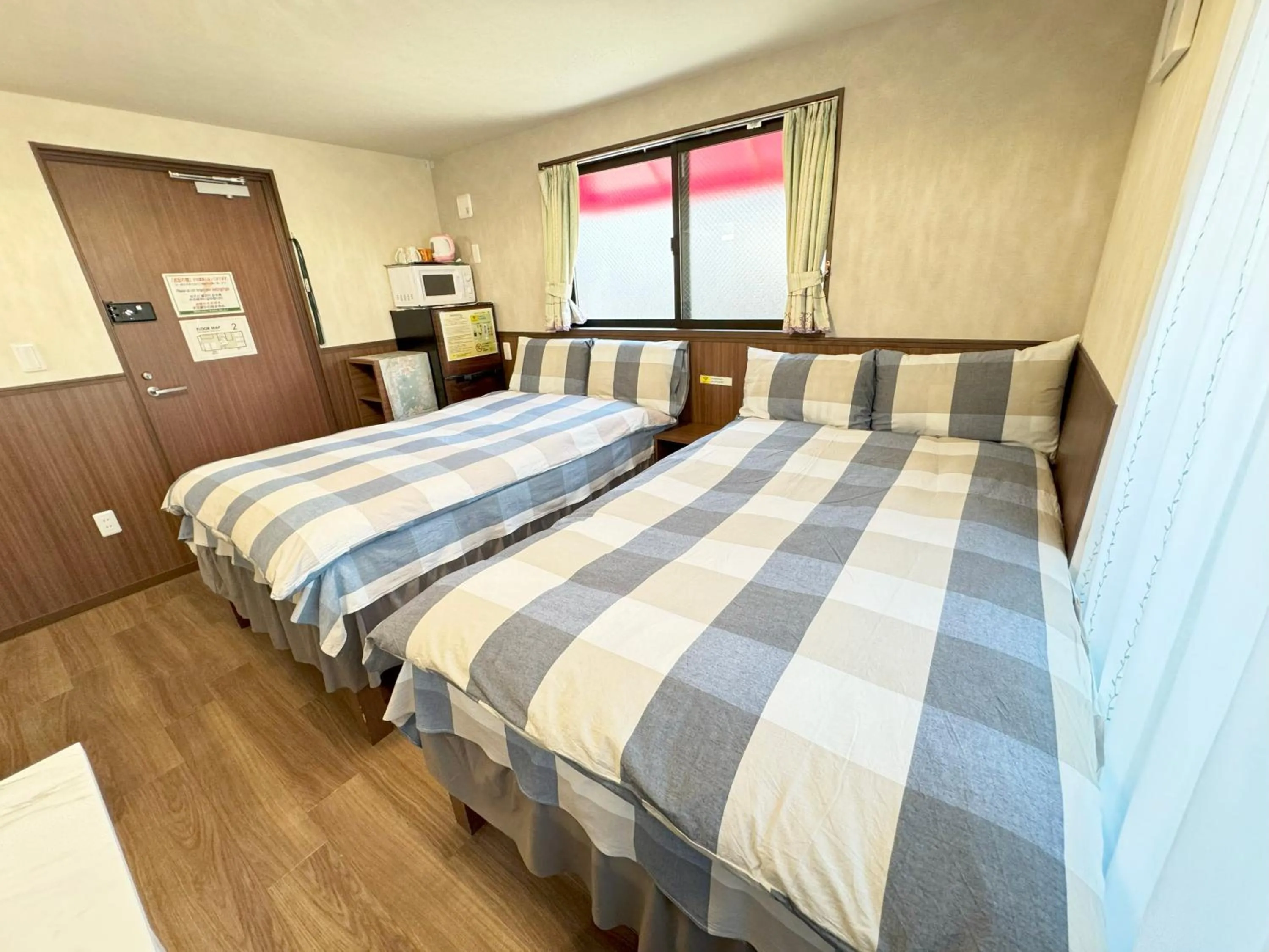 Bed in SHINJUKU WARM VILLA I