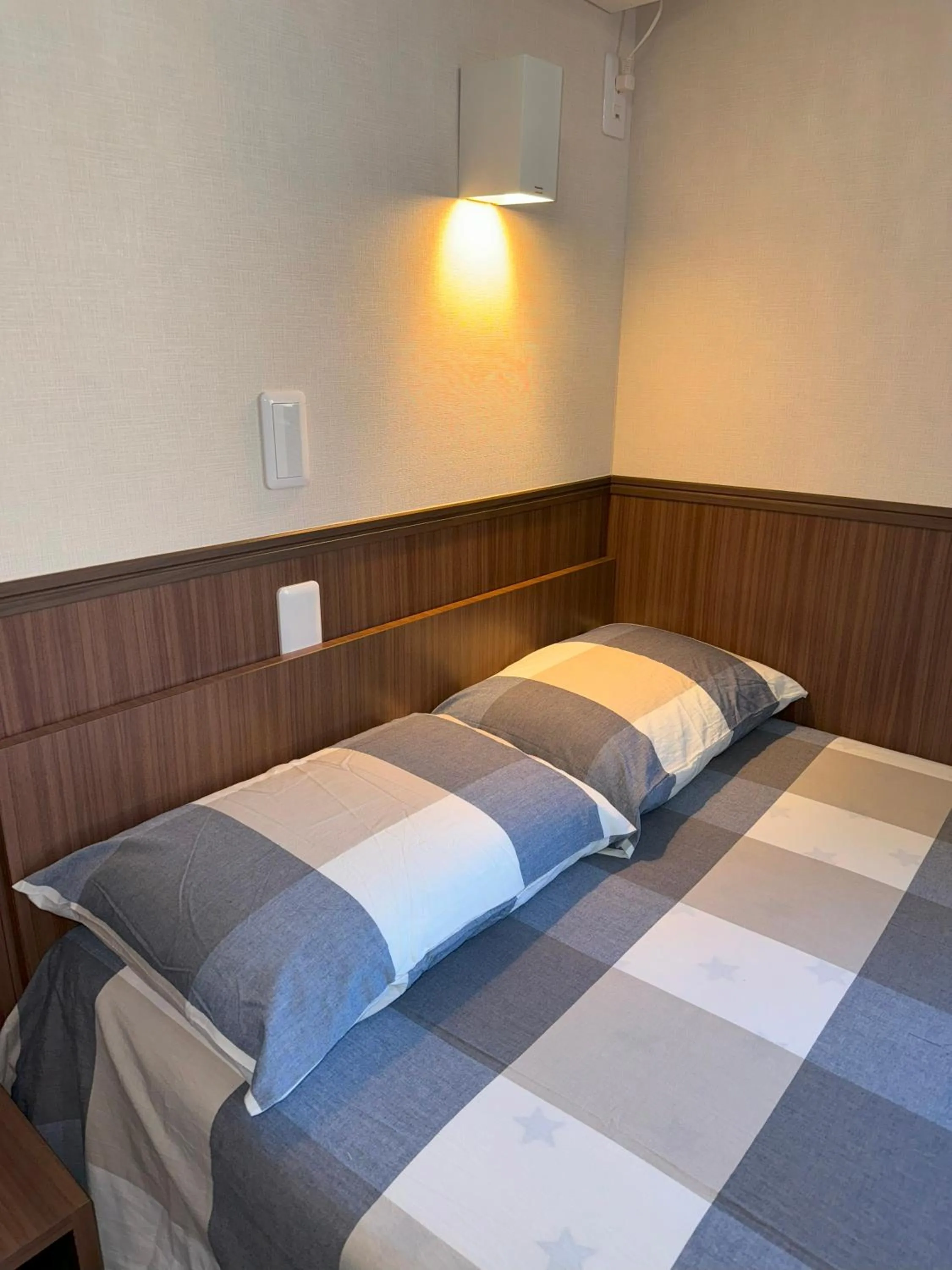 Bed in SHINJUKU WARM VILLA I