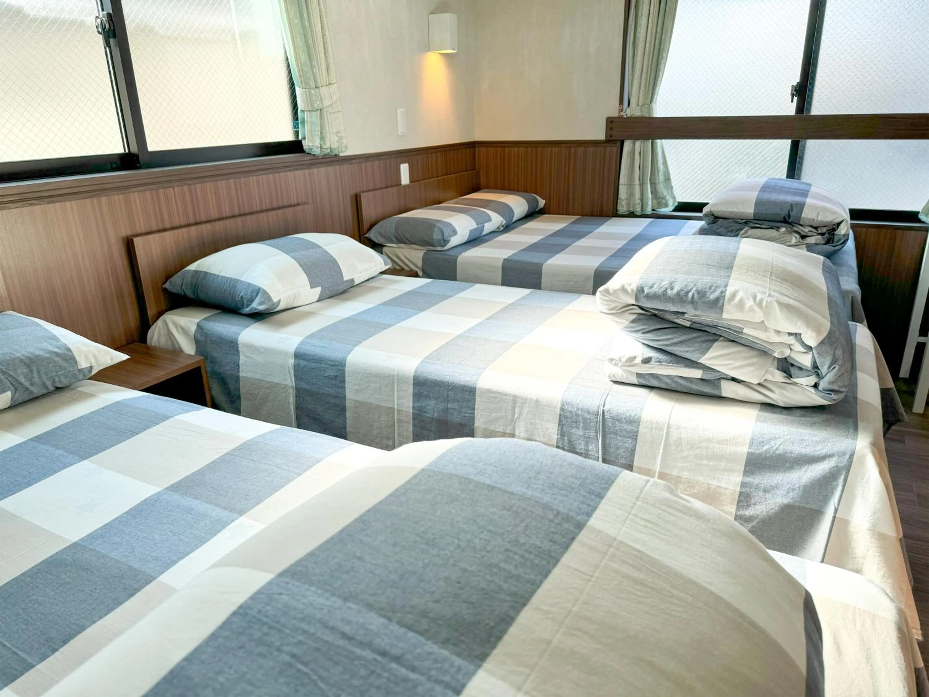 Bed in SHINJUKU WARM VILLA I