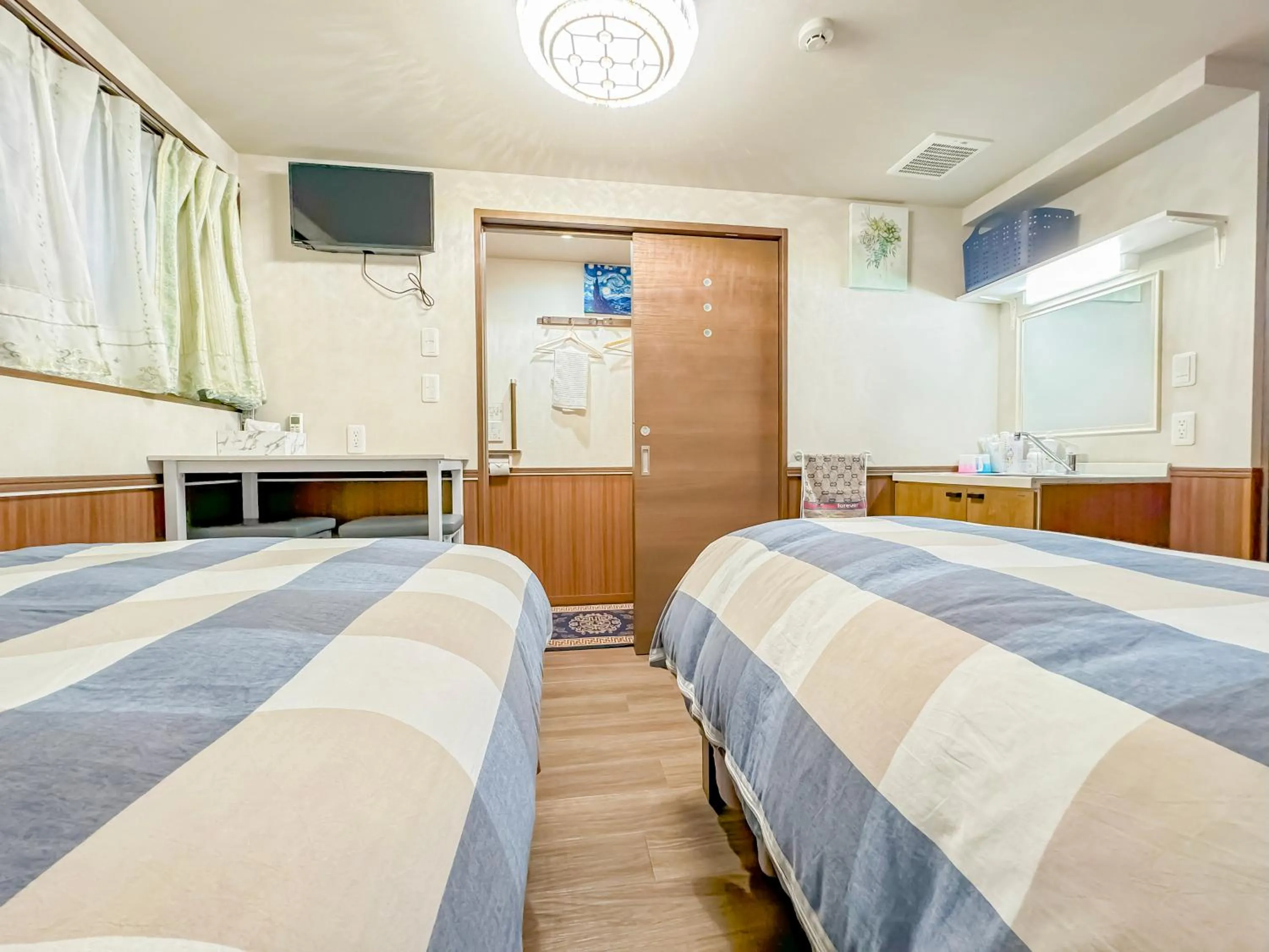 Bed in SHINJUKU WARM VILLA I