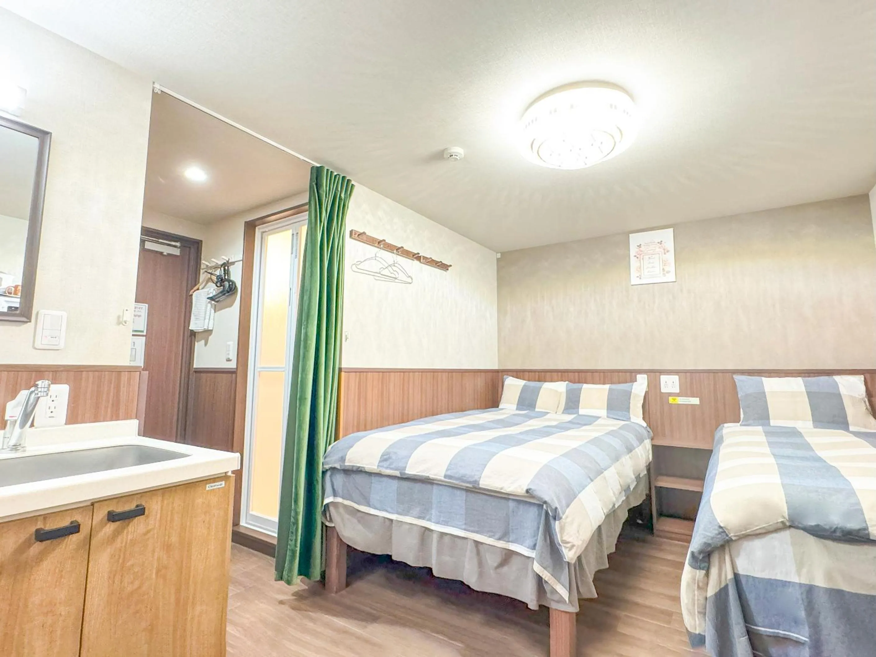 Bed in SHINJUKU WARM VILLA I