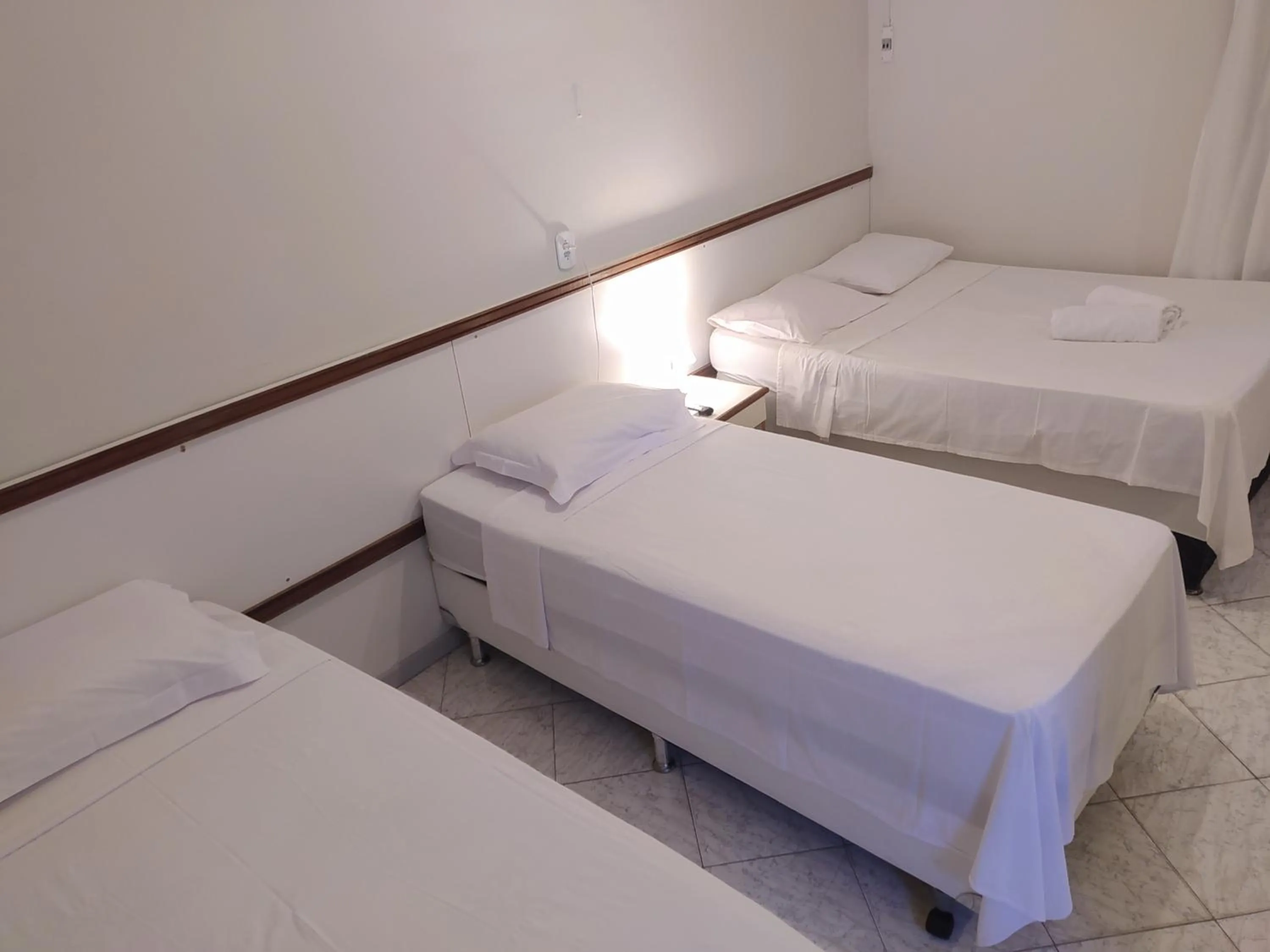 Bed in Pousada Aruamar