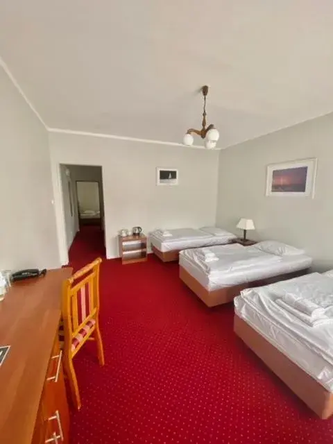 Economy Triple Room in Hotel Mazury Economy Triple Room in Hotel Mazury