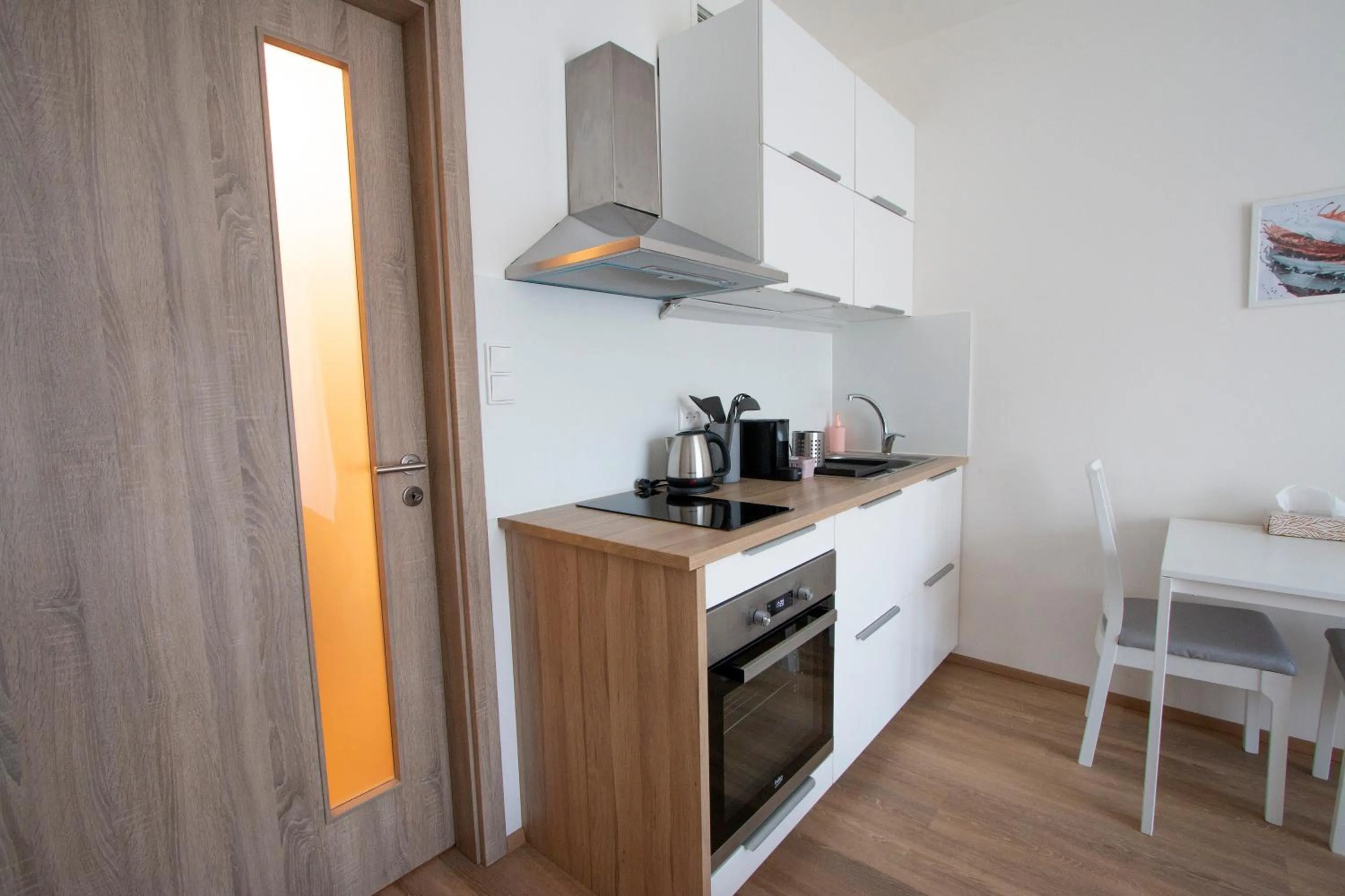 Kitchen or kitchenette in Kora Apartments