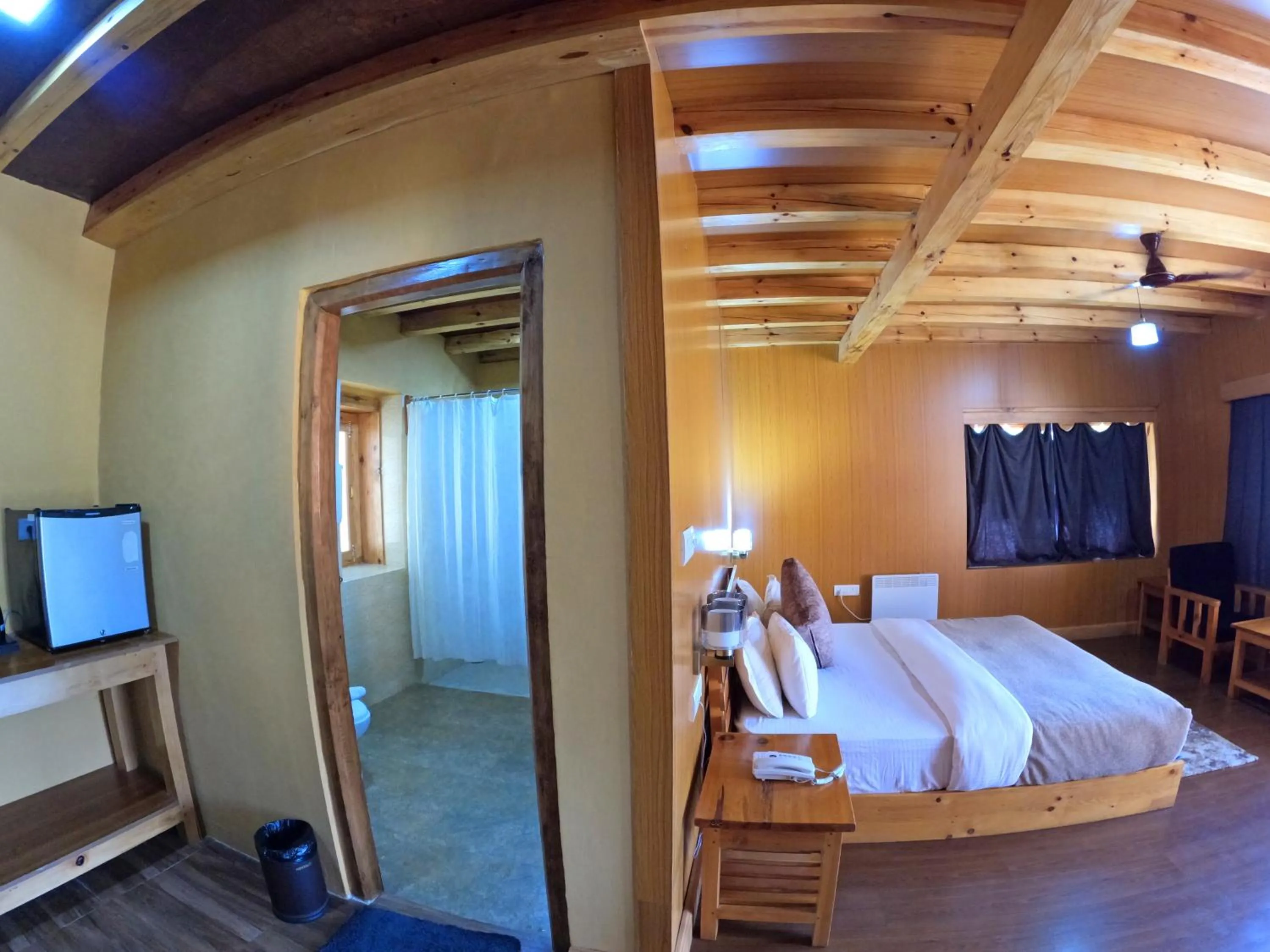 Communal lounge/ TV room, Bed in Rema Resort