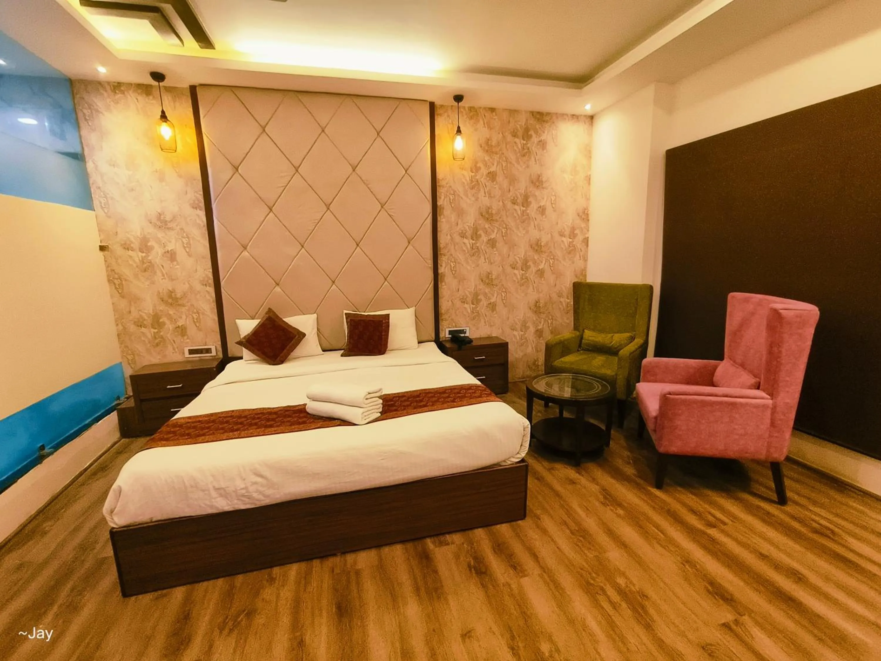 Bed in THE TRIUMPH Hotel