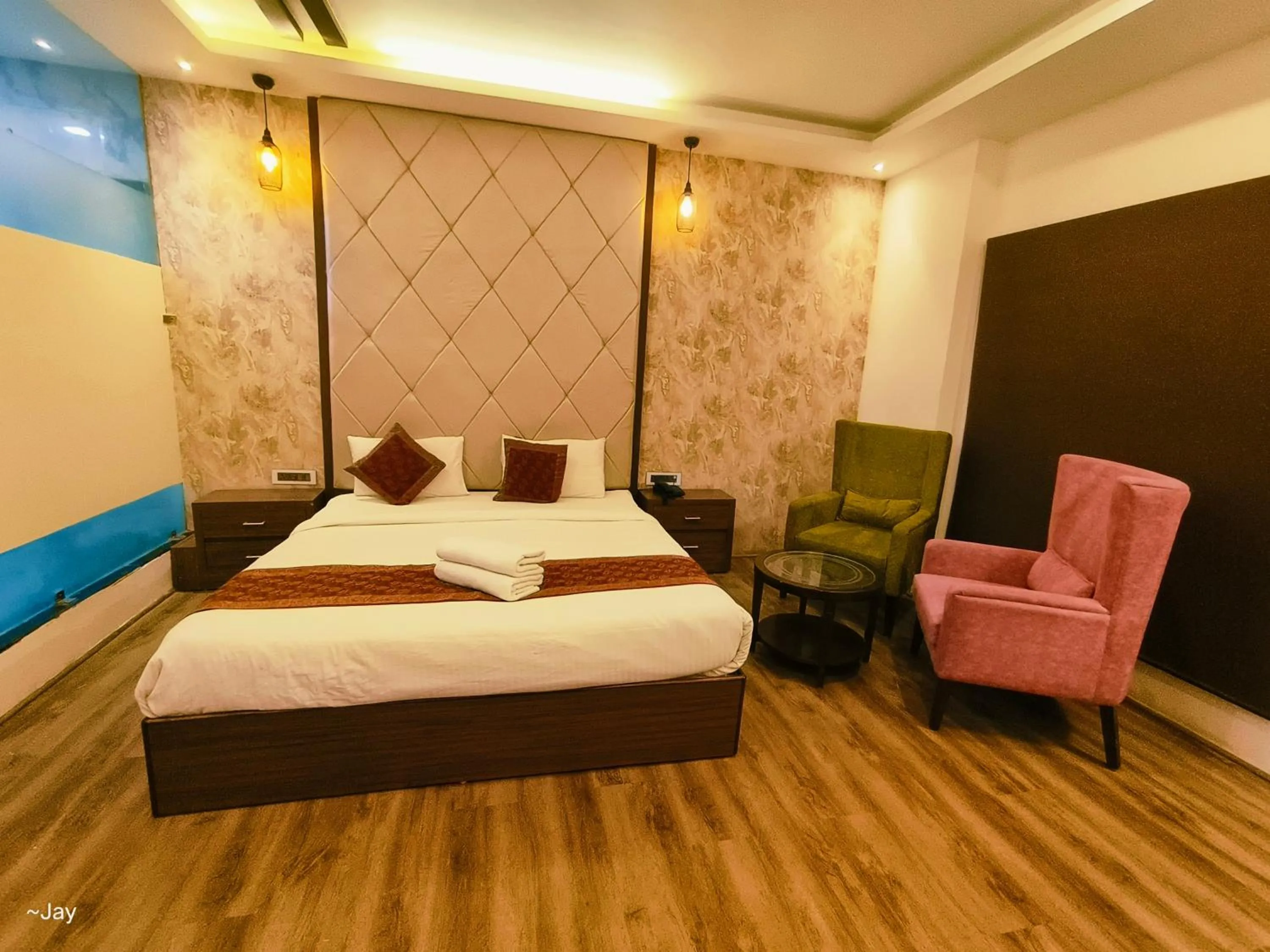 Bed in THE TRIUMPH Hotel