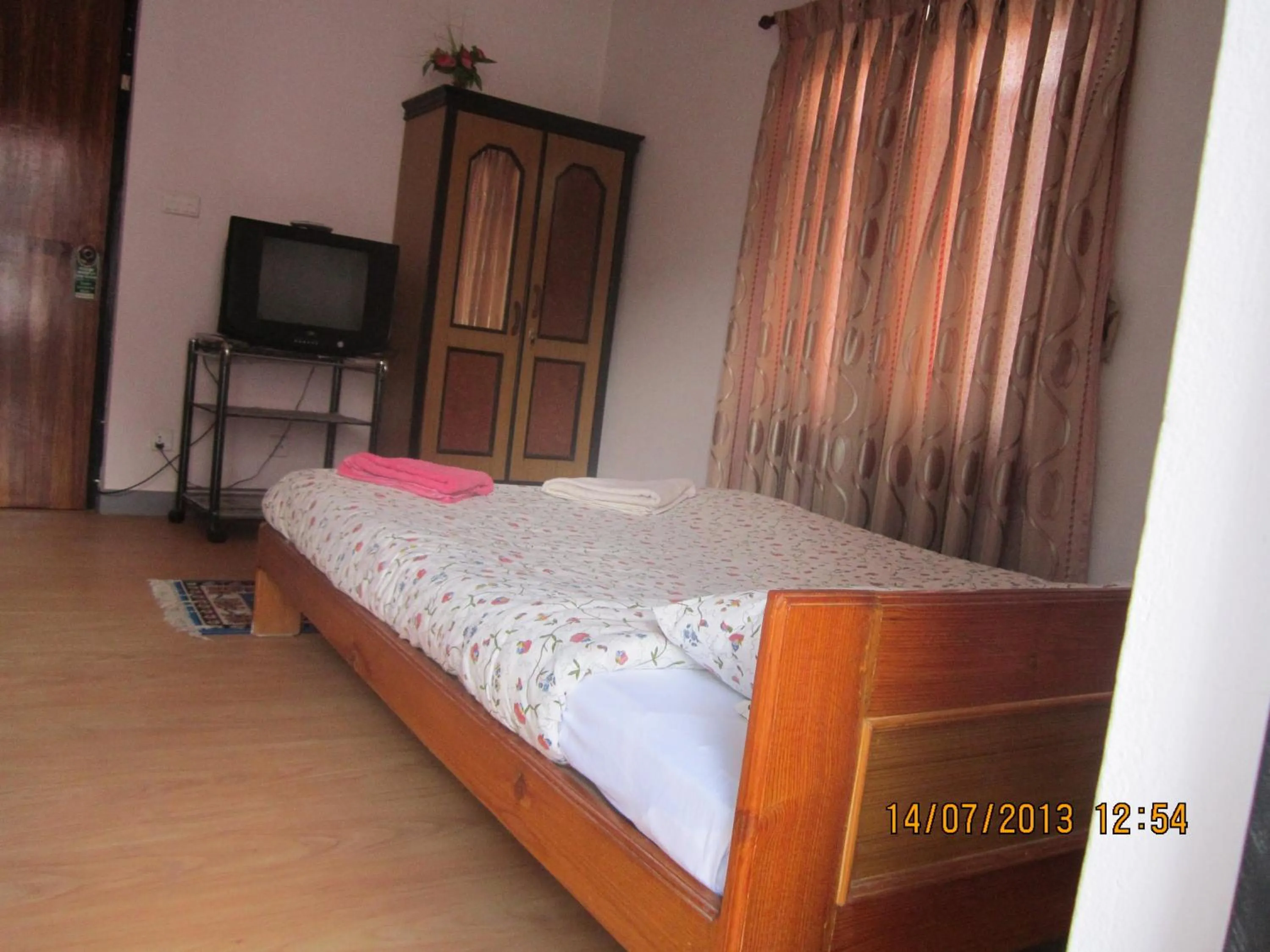 Bed in Le Rhododendron Chambres D'hotes