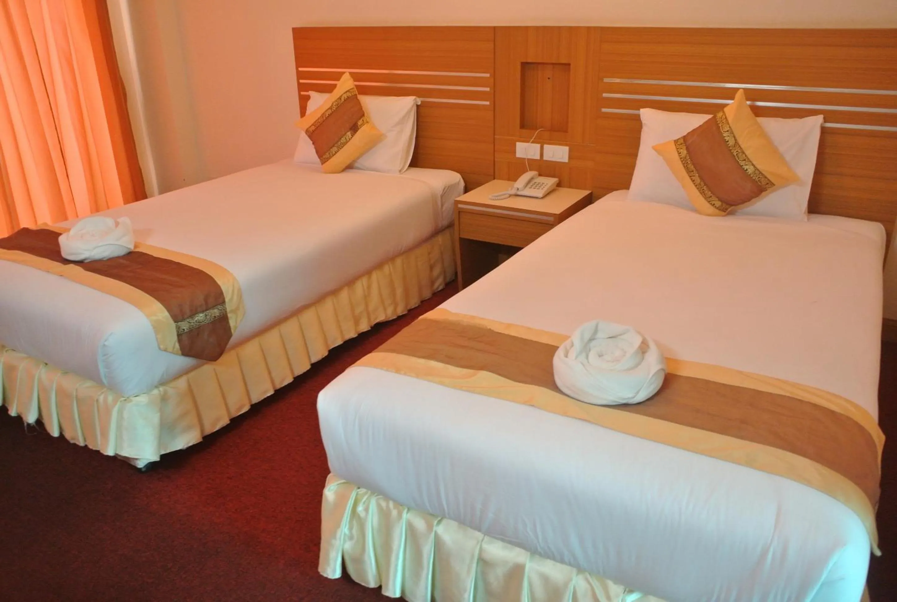 Bed in Chaikana Thani Hotel