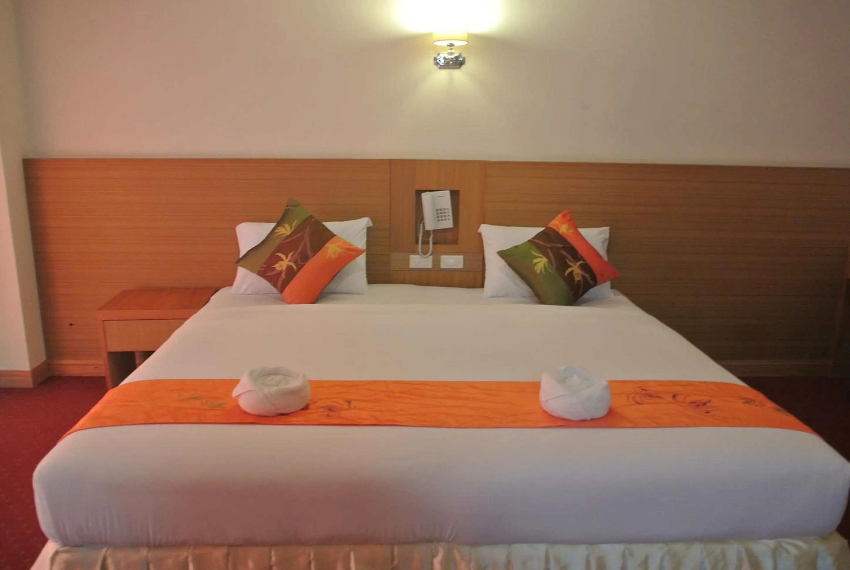 Bed in Chaikana Thani Hotel