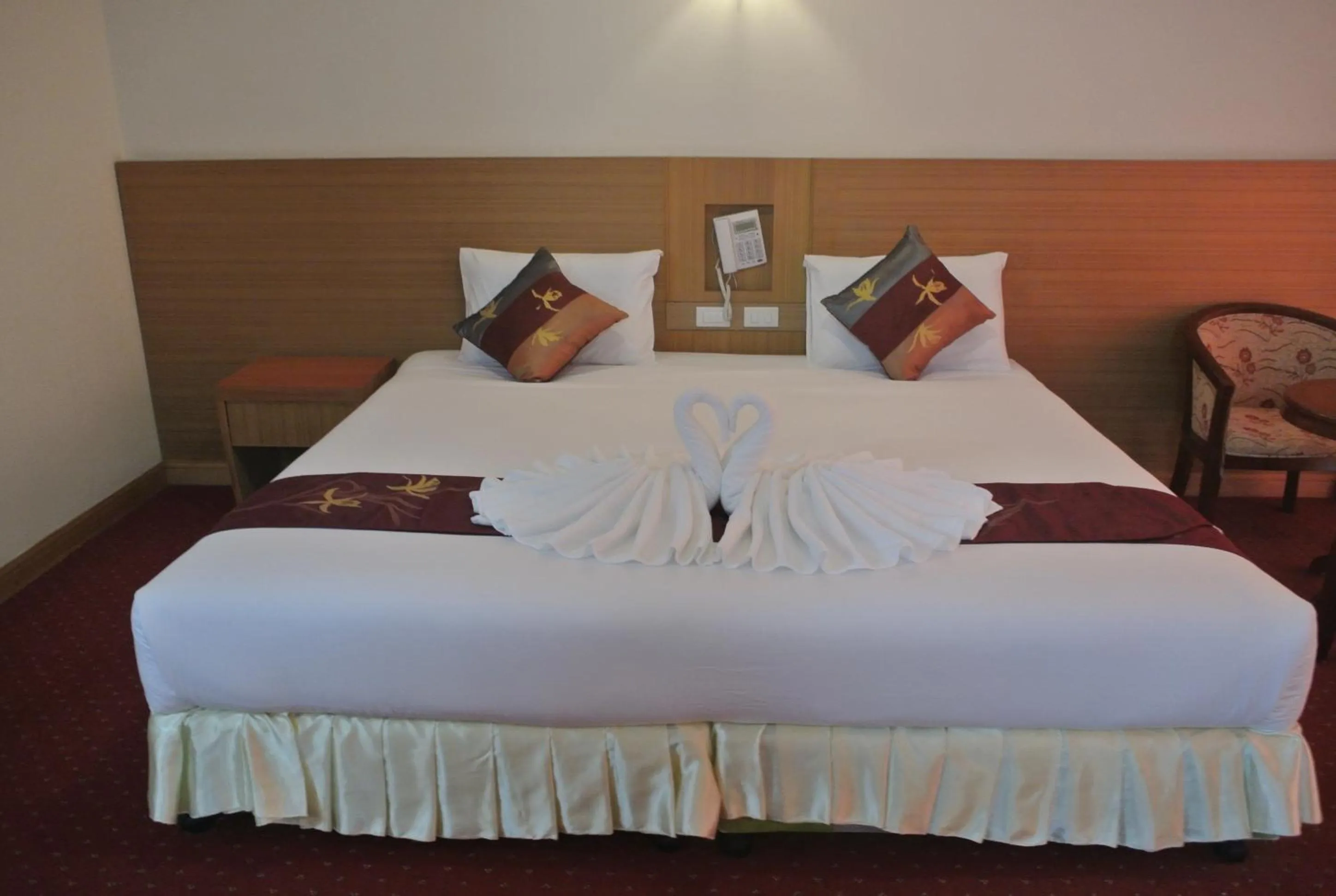 Bed in Chaikana Thani Hotel