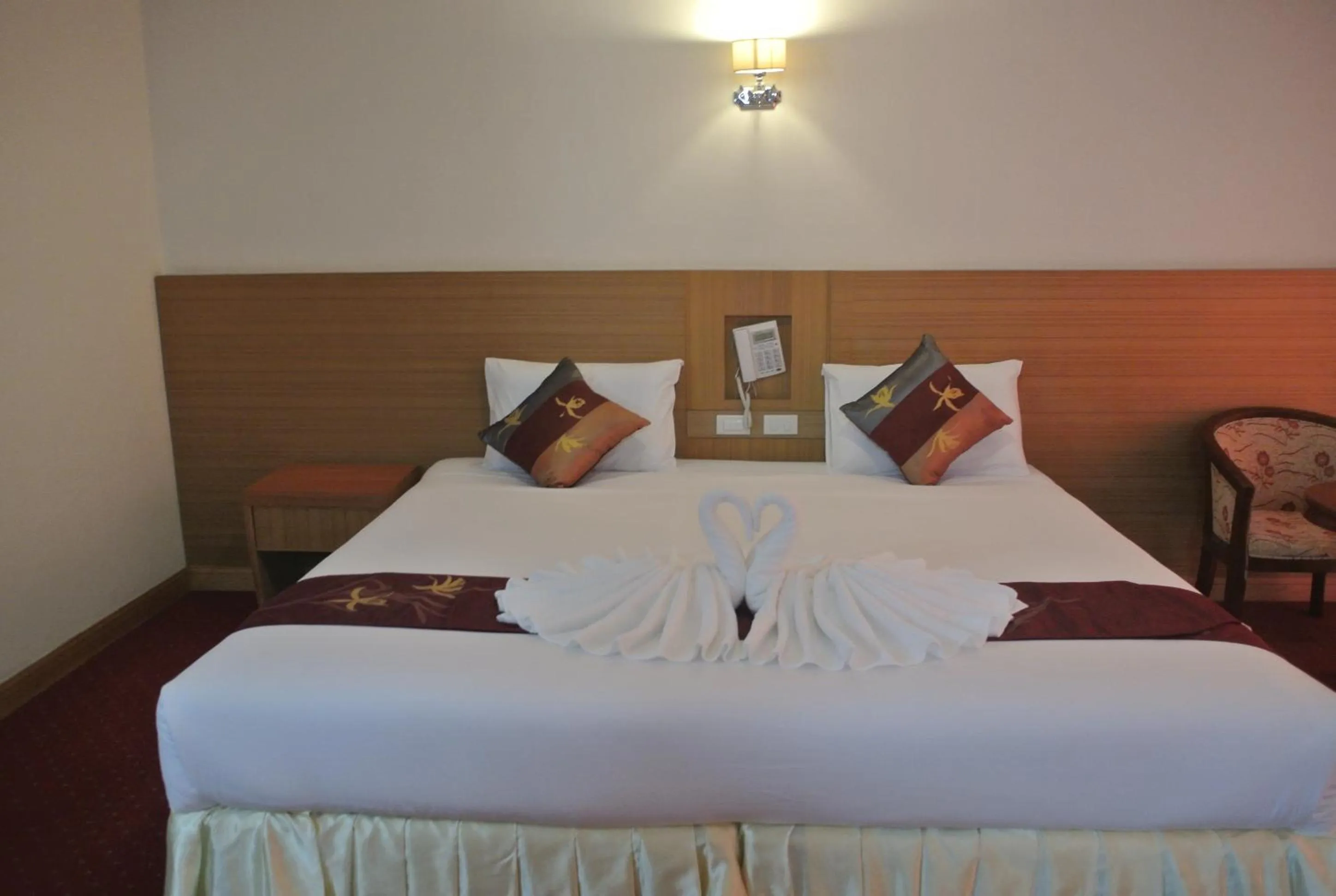 Bed in Chaikana Thani Hotel