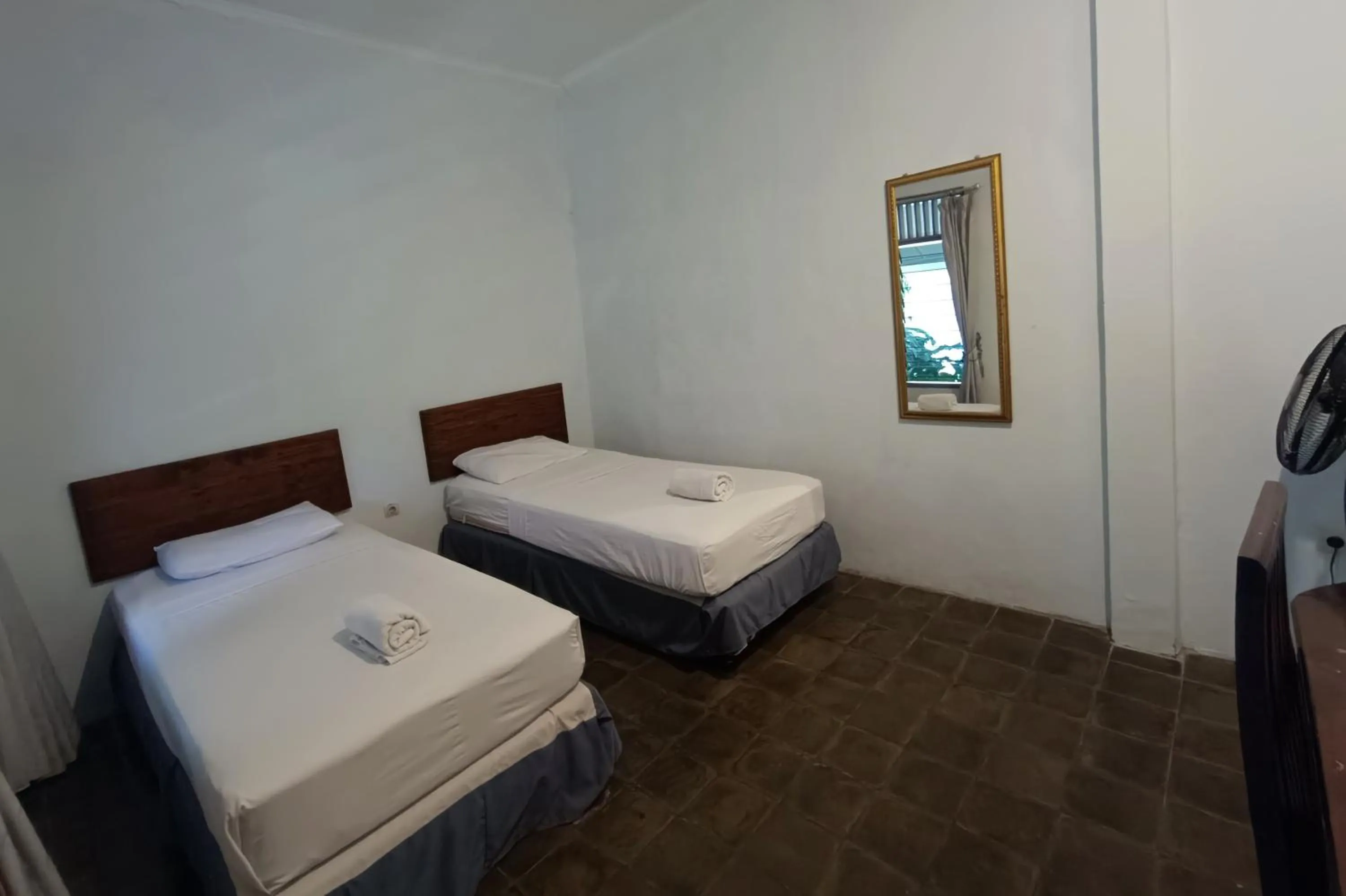 fireplace, Bed in Ndalem Mantrigawen