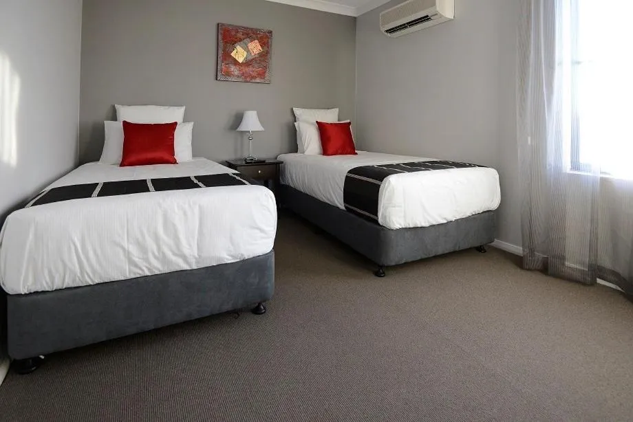 Bed in Astro Dish Motor Inn