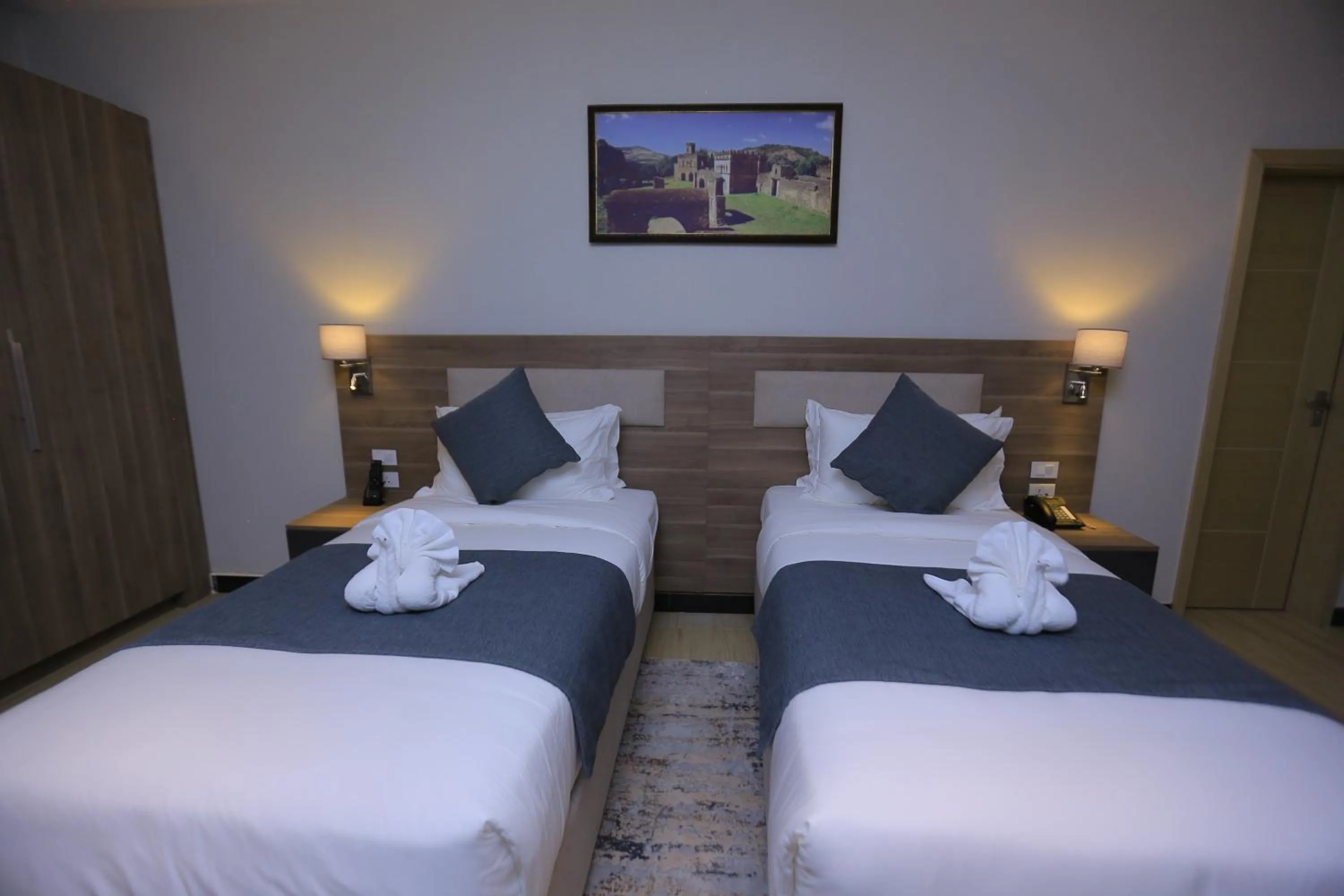 Bed in Triple E Hotel and Spa