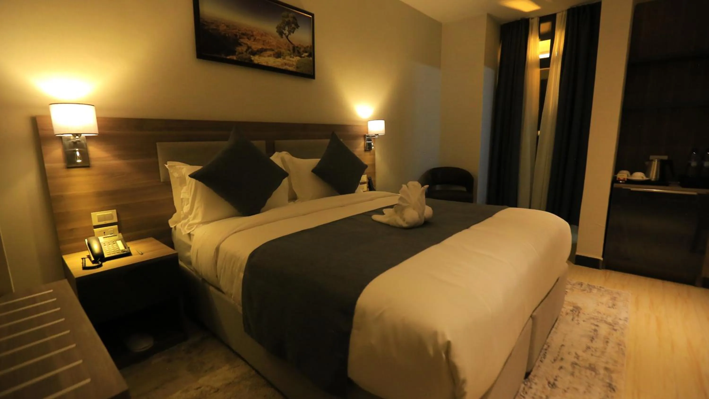 Bed in Triple E Hotel and Spa