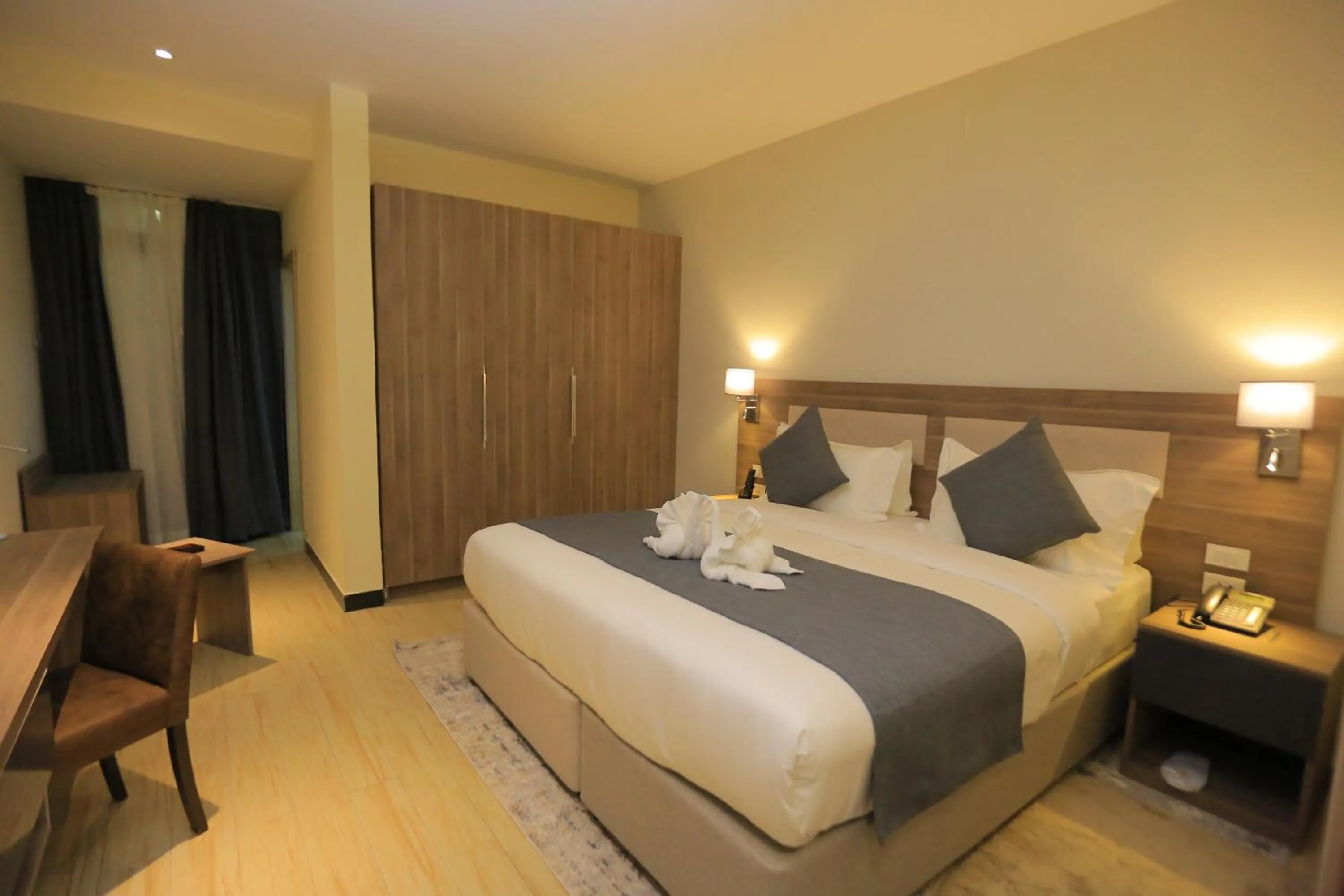 Bed in Triple E Hotel and Spa